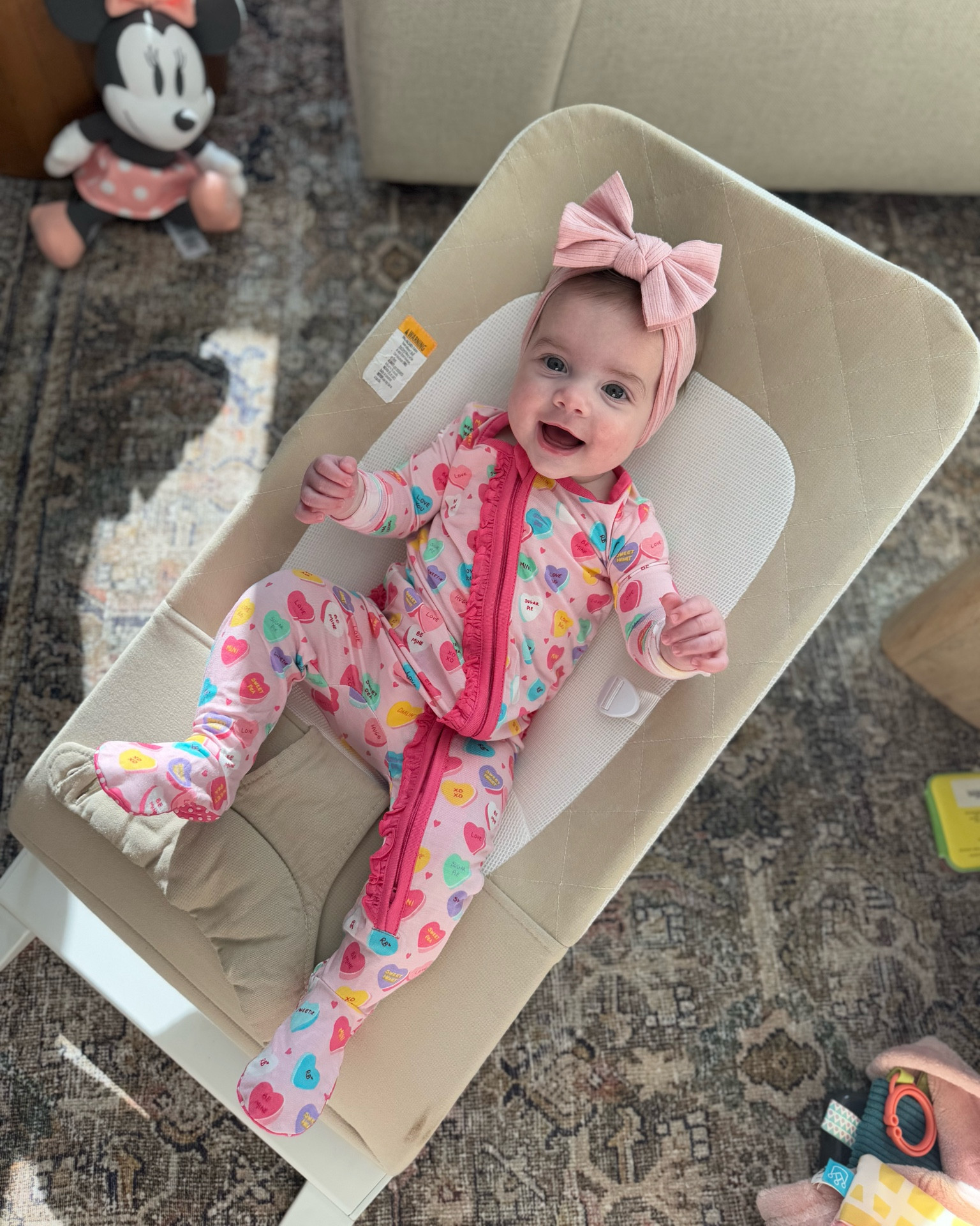 Cutie in her Valentine’s Day ruffebutts pajamas! They’re soo soft and come in a ton of prints. She’s in 6-9m! 🩷🩷 linking to her bow, comes in a pack & her bouncer! She still loves sitting in here! 

Babygirl, baby footie pajamas, rufflebutts, valentine candy hearts, ruffles pajamas, bamboo PJs, ribbed bows, bow headbands 

#LTKFamily #LTKFindsUnder50 #LTKBaby