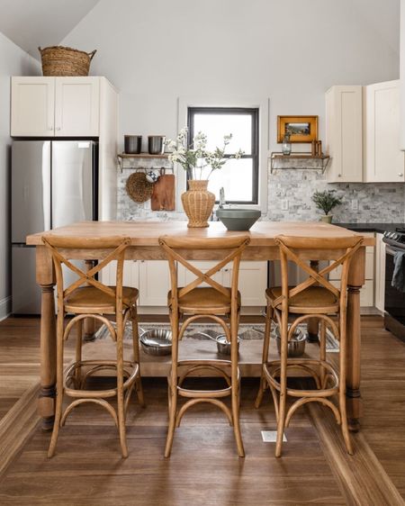The light, clean kitchen was brought to life through natural tones .

#LTKhome