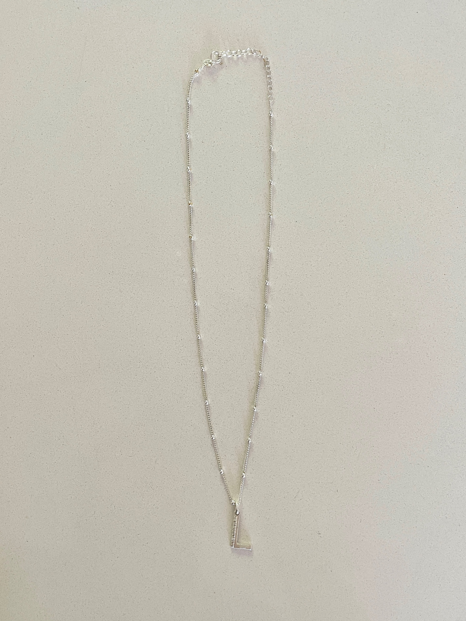 Radiate luxury with this texture initial diamond necklace ✨ I have it in the 18” to layer with shorter necklaces to create dimension. I love the bobble chain that’s unique to others and the diamonds on the letter. You can choose from different lengths for the chain and either gold or silver. Would make a lovely personalized gift 🎁  Use code: JULY15 for 15% off. 

Initial necklace, personalized necklace, jewelry, gold jewelry, silver jewelry, personalized jewelry, personalized gifts, gift guide, gift ideas, sale, The Stylizt 



#LTKWorkwear #LTKSaleAlert #LTKStyleTip