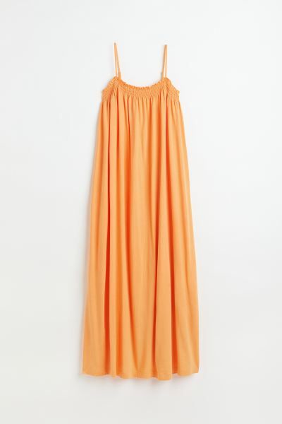 Long, relaxed-fit dress in jersey made from a modal and cotton blend. Narrow, adjustable shoulder... | H&M (US + CA)