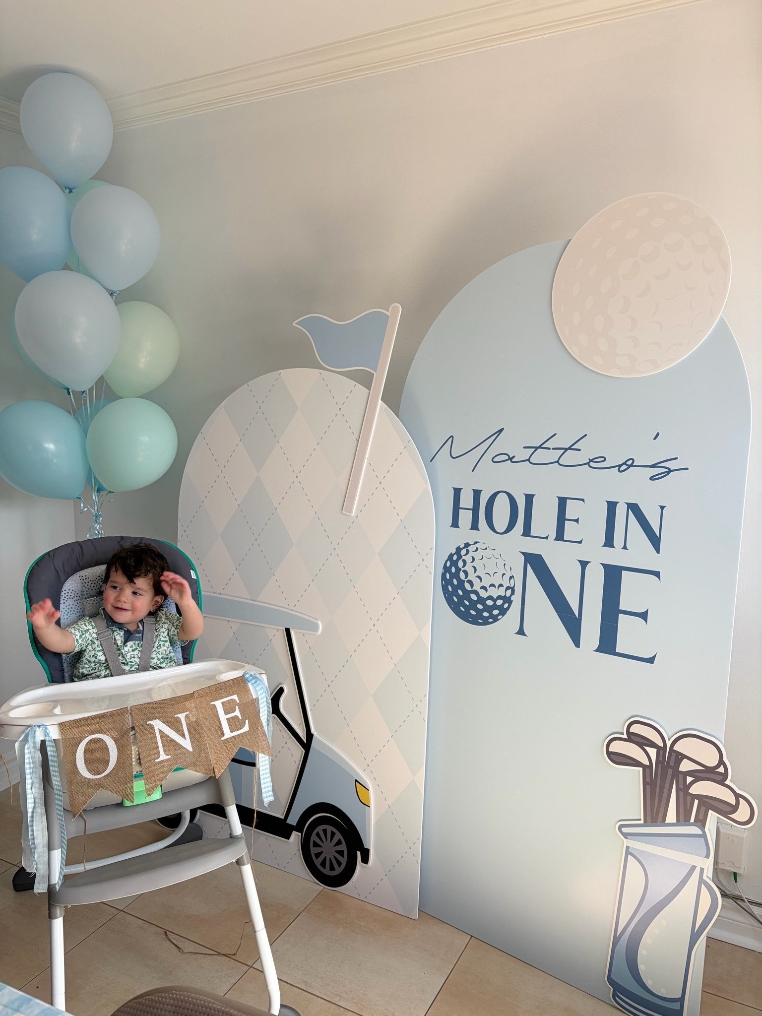 baby boys  first birthday high chair  banner 
I added gingham ribbon from Michael’s and ribbon from the dollar store 
Baby’s first birthday golf theme 
Hole in one birthday for baby

#LTKbaby #LTKkids #LTKfamily