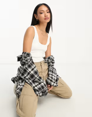 ASOS DESIGN scoop neck ribbed bodysuit in white | ASOS (Global)