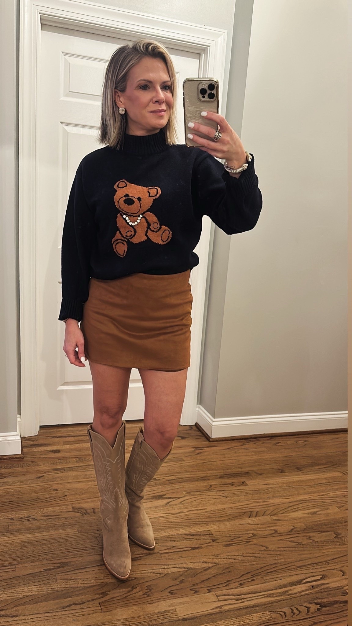 Teddy bear sweater is marked way down!  Paired with a suede skort and the Abby by tecovas cowboy boot  

#LTKFindsUnder50 #LTKSaleAlert #LTKootd