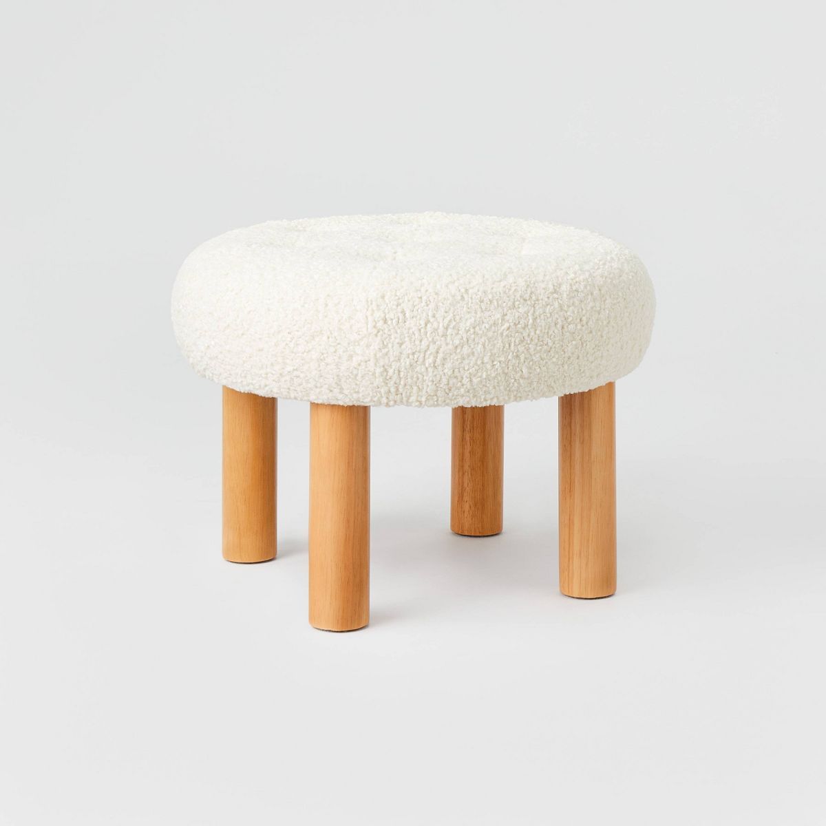 Kessler Round Tufted Faux Shearling Ottoman with Wood Legs Cream - Threshold™ designed with Stu... | Target