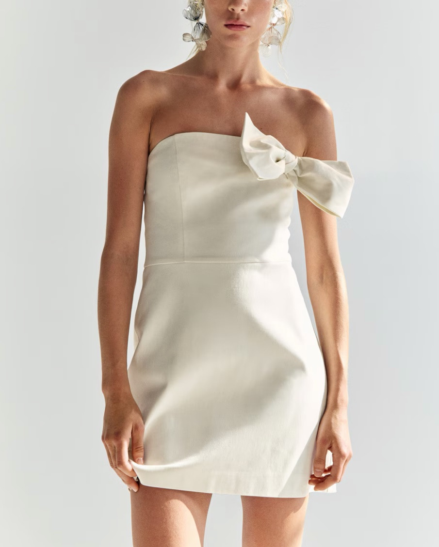 White bow detail strapless cocktail dress 
Bridal shower 
Bachelorette party 
Engagement party 
Engagement photos

#LTKSeasonal