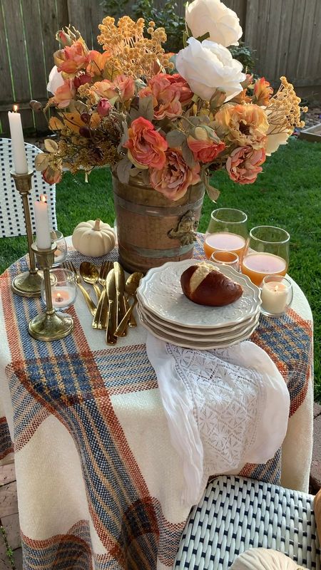 Set an outdoor autumnal table setting!! I like have a base of what I call tablescape staples, and I use these often for tablescapes throughout the year. 
My table staples are:

Pioneer Woman Dishes
Gold Flatware
Gold or Brass Candlesticks 

Then I mix up the tablecloth, linens and centerpiece. You can see more of the details on my blog at rouseinthehouse.co! 🍂🍂🫶



#LTKHoliday #LTKunder50 #LTKSeasonal