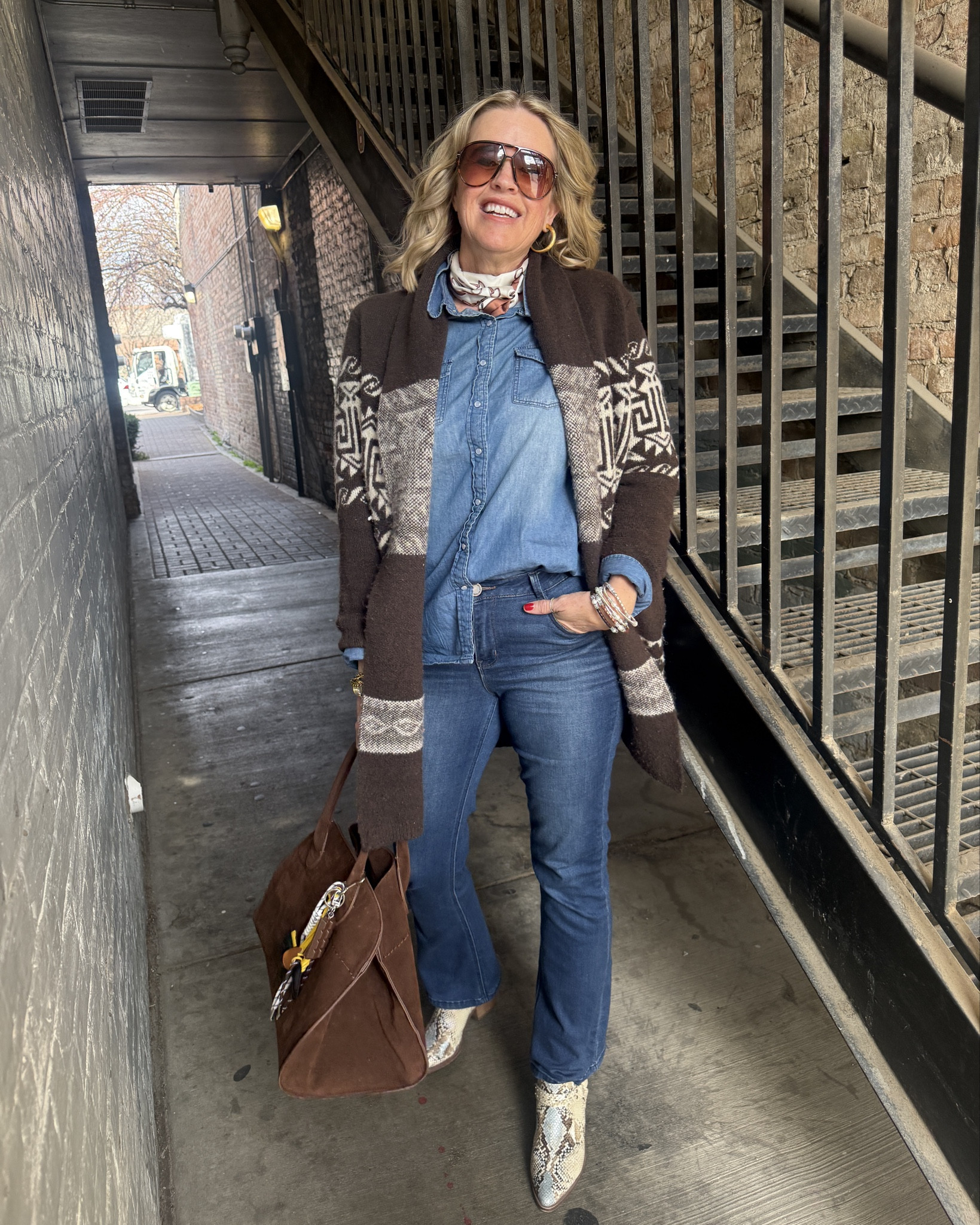Over 50
Outfit of the day

Western inspired, what I wore as a Utah living, over 50 year old to lunch with my hubby. 

Denim on denim. With a Navajo sweater, very Ralph Loren inspired like. (Mine is vintage)
I will link similar 

Denim button up top tts

Wit and wisdom itty bitty flare denim with tummy support tts in a size 4 , elongate the leg

Snake skin blue and tan western booties (old) linked similar 

Julie Vos gold hoops and ring

Horse bit silk scarf around neck

Amazon find suede bag and charms (sold separately) 

Bracelets pearls by Sheri 
Not linkable 

#LTKdayinmylife #LTKootd #LTKgrwm