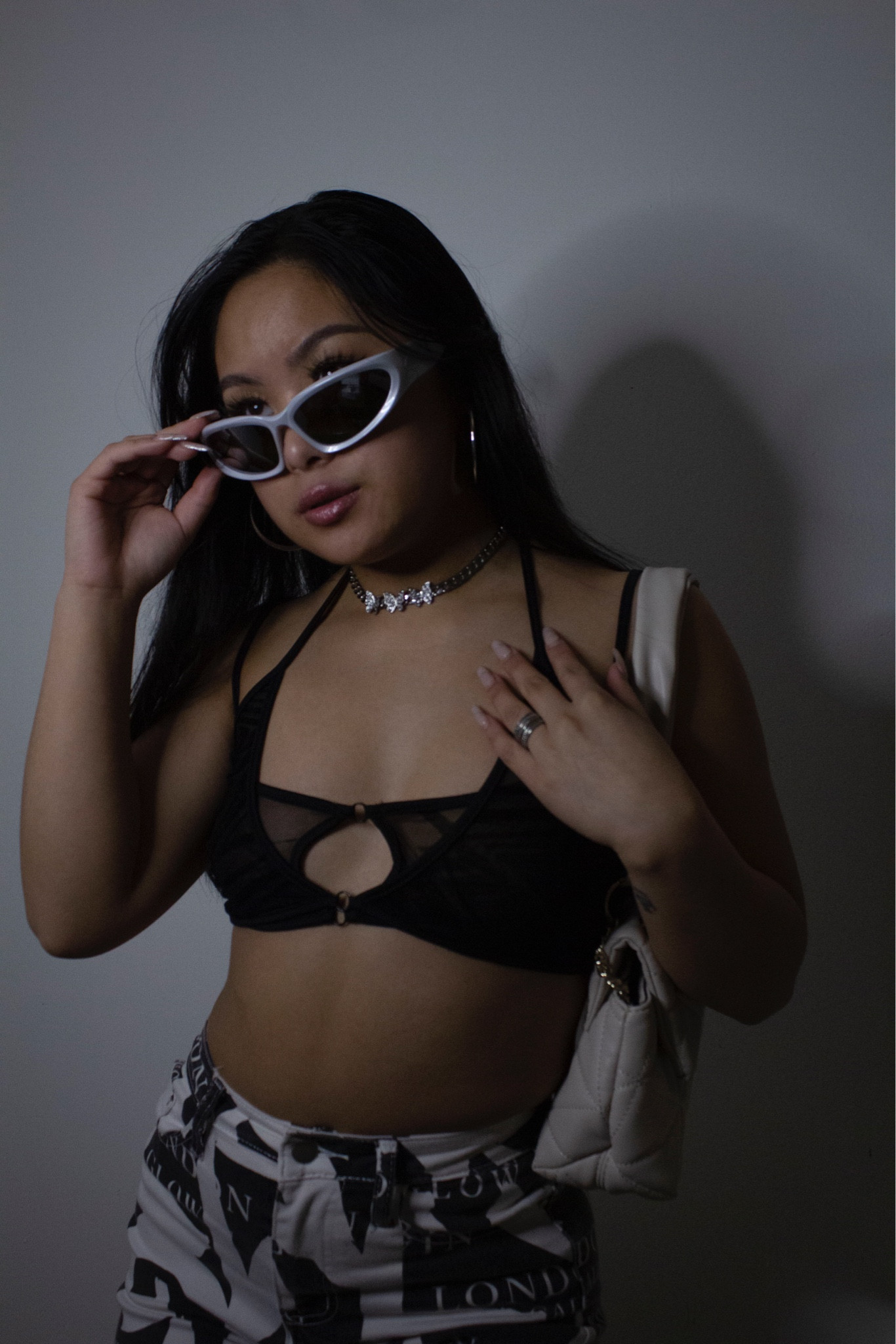 street style, hip hop fashion, cyber inspired, printed pants, strappy bralette/ crop top, white croissant purse

#LTKfit #LTKstyletip