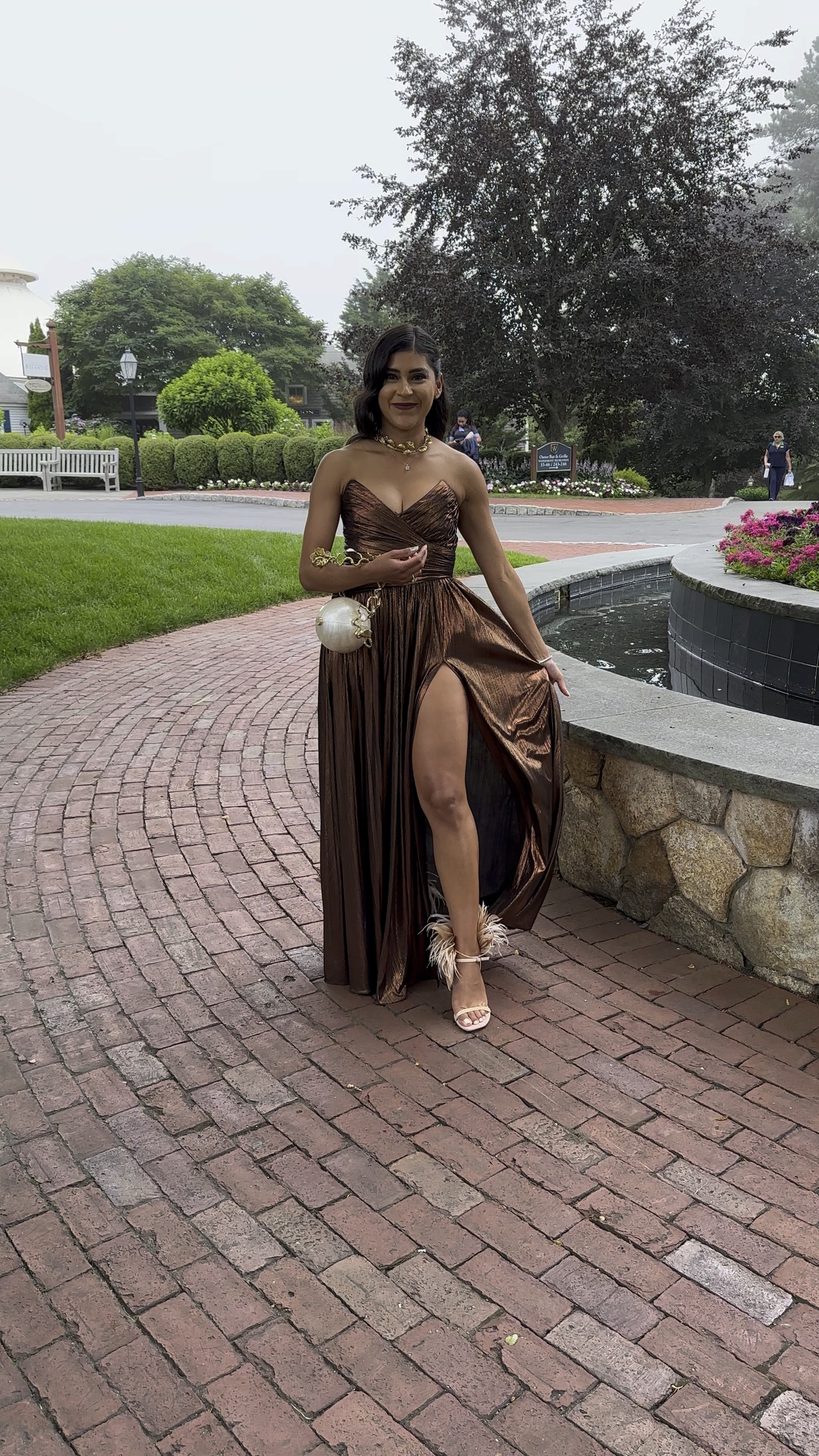 Black tie wedding guest gown and accessories ✨. I wore this dress from 1 pm - 10 pm and was mostly comfortable the entire night. That says a lot for special occasion garments! Gown features sexy thigh high slit and does not wrinkle…making it a good choice if you have to travel to your event 👏🏽. Sandals are currently 50% off - I suggest sizing half size up if in between sizes  I will definitely be repeating this look in the near future! #weddingguestdresss #revolve #stuartweitzman #petitefashion #weddingseason 

#LTKsalealert #LTKstyletip #LTKwedding