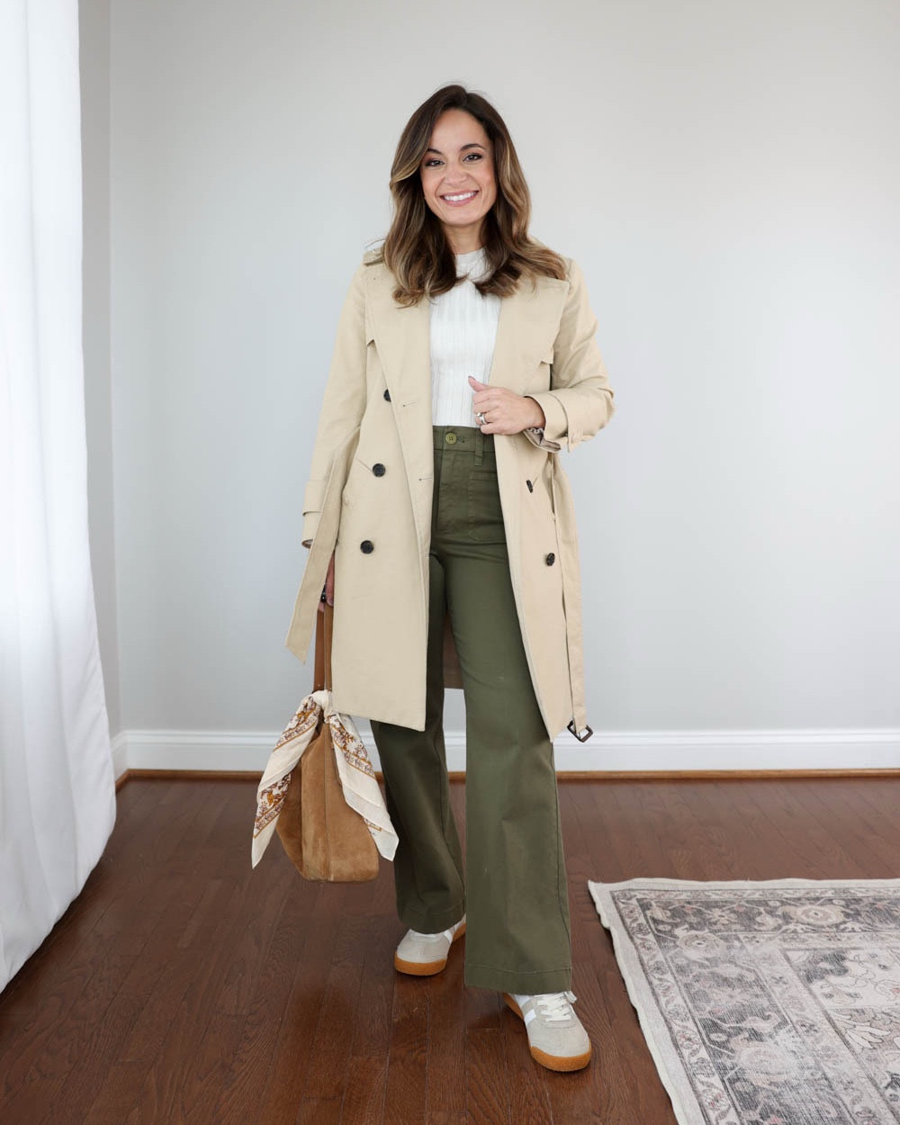 How to style the J.Crew Icon Trench Coat for early Spring!

Trench coat (J.Crew): petite 00

Outfit 1:
Pants (J.Crew): 24 in classic length | 28” inseam in classic
White top (Quince): in heathered bone
Bag (J.Crew)
Sneakers (Gola): tts - starts at a size 5 | in bone/white 

Outfit 2:
Navy pants (Banana Republic Factory): petite xxs/00 - 10” rise, 27.5” inseam. True to size
Button down (J.Crew Factory): petite xxs
Scarf (Similar linked)
Loafers (Sam Edelman): tts in French sand

Outfit 3:
Dress (WHBM): petite 0 - recommend petite 00 if you go off of my sizing, it’s large on me in petite 0
Button down (J.Crew Factory): petite xxs
Tote (Quince)
Heels (Sam Edelman)

My measurements for reference: I’m 4’10” and 105lbs. My bust, waist, and hip measurement is 32”, 24”, and 36”.

#LTKPetite #LTKWorkwear #LTKSeasonal