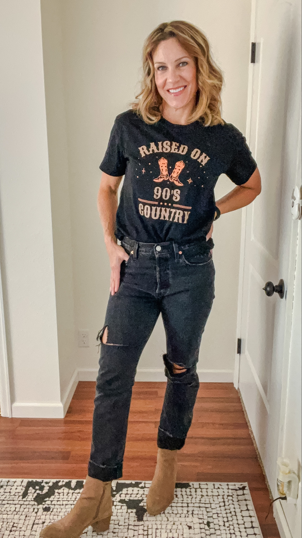 Raised on 90’s Country tee and Levi’s jeans paired with a simple boot. Easy outfit for fall. #levis #outfit #blackjeans #graphictee #teeoutfit

#LTKSeasonal #LTKsalealert #LTKstyletip