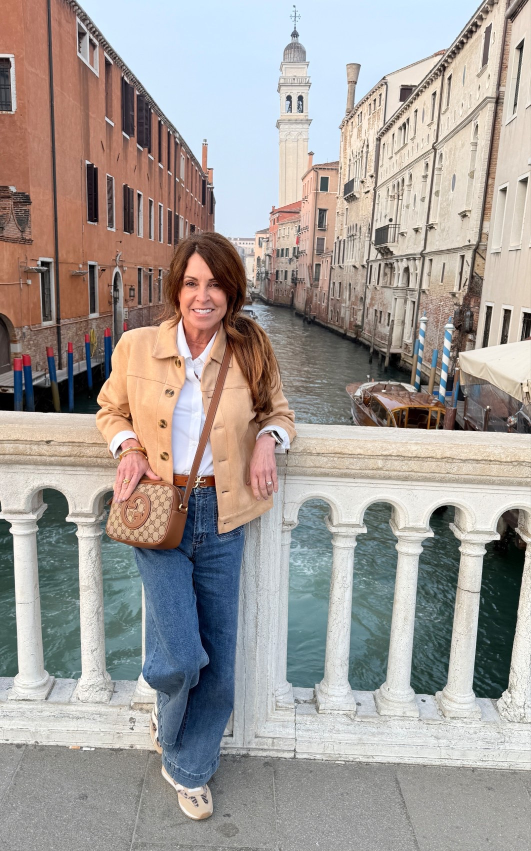 Sightseeing outfit: a tan faux suede jacket with jeans and sneakers to take in the sights in Venice. Wrinkle resistant jacket. Wide leg jeans.

#LTKCyberWeek #LTKOver40 #LTKPetite