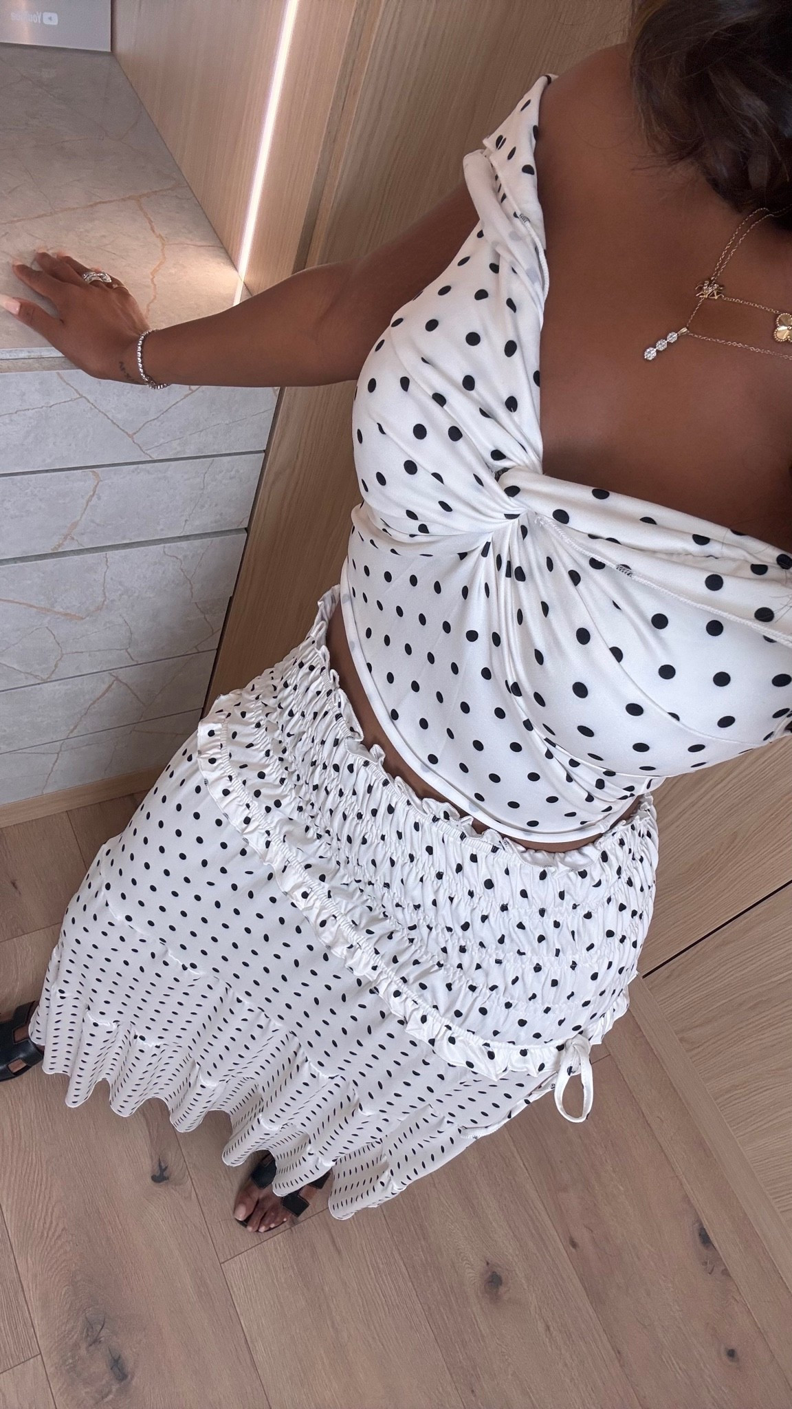 Hi Babes! 🖤🤍

This polka dot set is EVERYTHING! It gives effortless European summer vibes with the flattering twist-front top and the flowy matching skirt. The kind of outfit that makes you look instantly put together with minimal effort!

✨ Fit Details:
• Wearing a Size Small
• True to size
• Stretchy, comfortable top with a flattering twist detail
• Smocked waist skirt for an easy, comfortable fit

🤍 Where to Wear:
• Vacation dinners
• Brunch with the girls
• Resort nights
• Date night
• Summer events
• Coastal getaways

✨ Style Tip:
I paired it with simple black slides and a white shoulder bag for a timeless look, but it would also be gorgeous with strappy heels and gold jewelry for an elevated evening outfit.

Everything is linked below!

xx, Kira | IG: KirasFashionFinds

Measurements:
5'4" | Size Small | 140 lbs