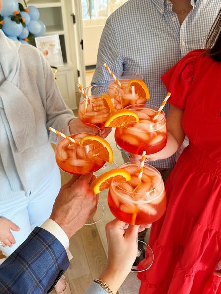 We used these fun spritz glasses for the party with extra long stems! Great for the summer and entertaining!🥂🍊