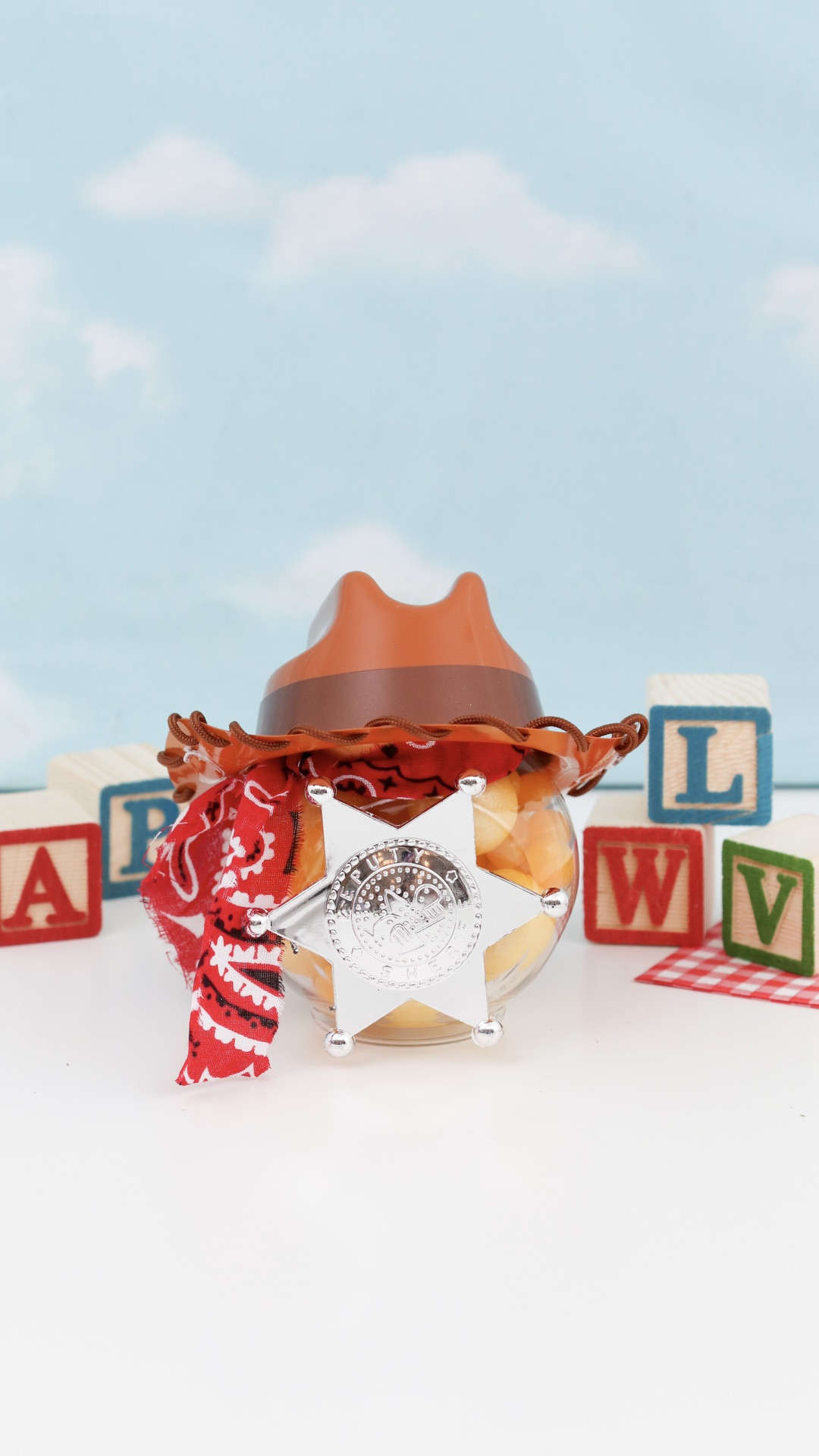 if your kid is obsessed with Toy Story right now, this one's for you 🤠

Dollar Tree jar filled with yellow candy, a bandana necktie, Woody hat and a sheriff badge on the front — DIY and so easy to put together!

…and if Woody isn't their character — I've also got Lightning McQueen, Minions, Barbie and Harry Potter versions on the blog 🎉

#LTKmomlife #LTKKids #LTKHome