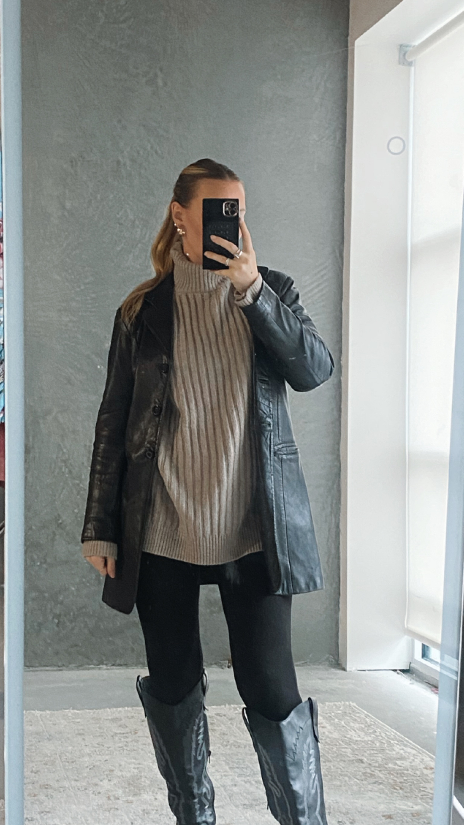 Long leather jacket and ribbed turtleneck sweater outfit 