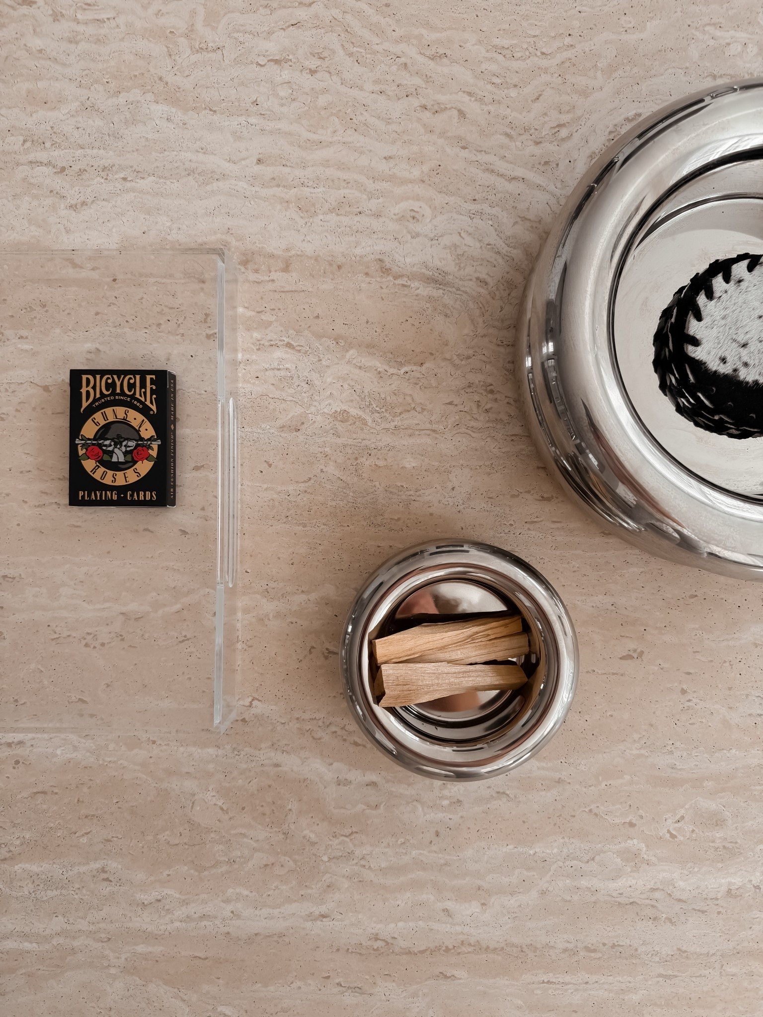 My son always wants to play cards, and my husband loves Guns N’ Roses so these cards were a must to have out

CB2 enyo travertine coffee table ,  Piero Polished Stainless Steel Serving Bowl By Gianfranco Frattini, home decor, coffee table styling, 

#LTKHome #LTKSaleAlert #LTKmomlife