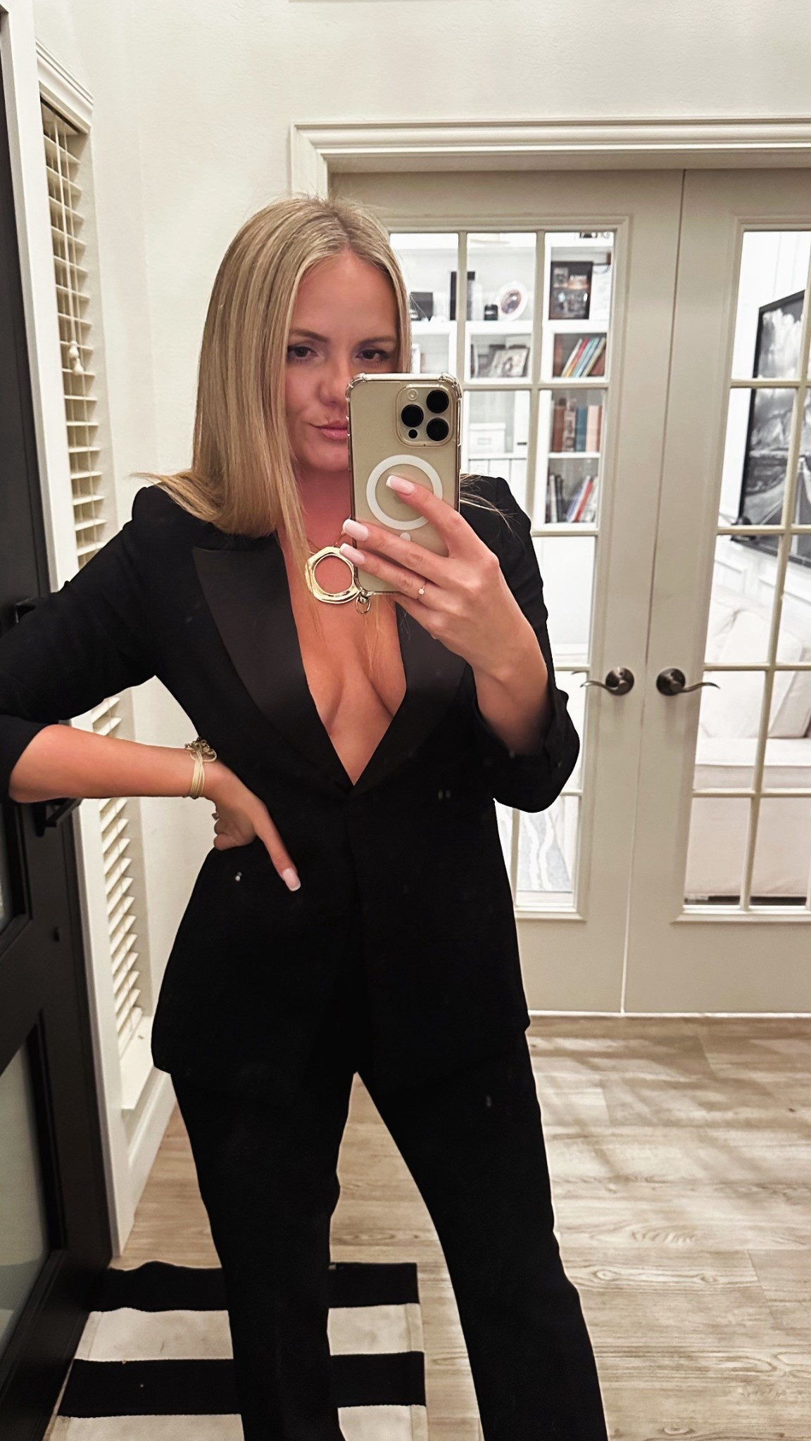 Ettika circle necklace 
Ettika bracelet 
Total black outfit 

#LTKHoliday #LTKootd #LTKWorkwear