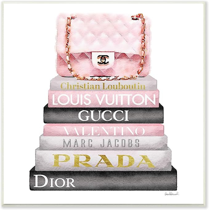 The Stupell Home Decor Collection Watercolor High Fashion Bookstack Padded Pink Bag Wall Plaque A... | Amazon (US)