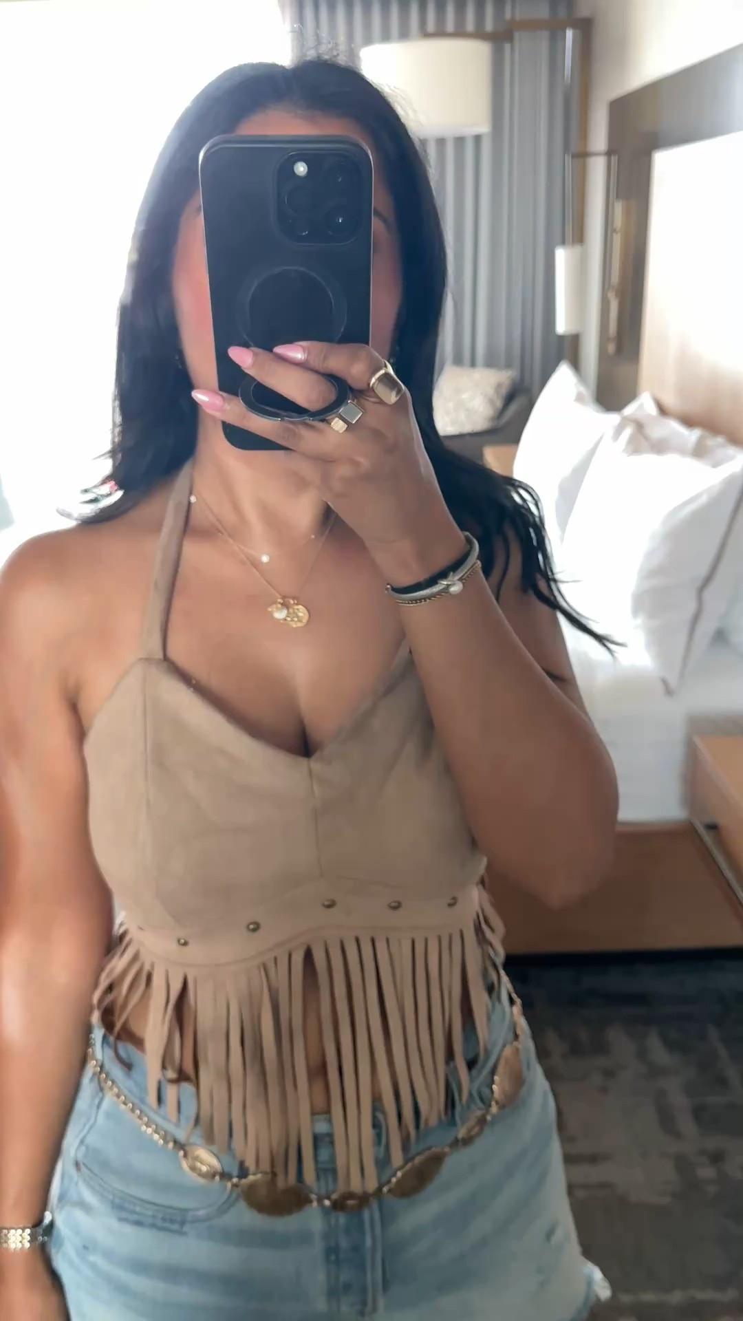 Wearing my normal size in the top.bag is adjustable to be shoulder length (but strap does hang but easy to tuck in the bag)