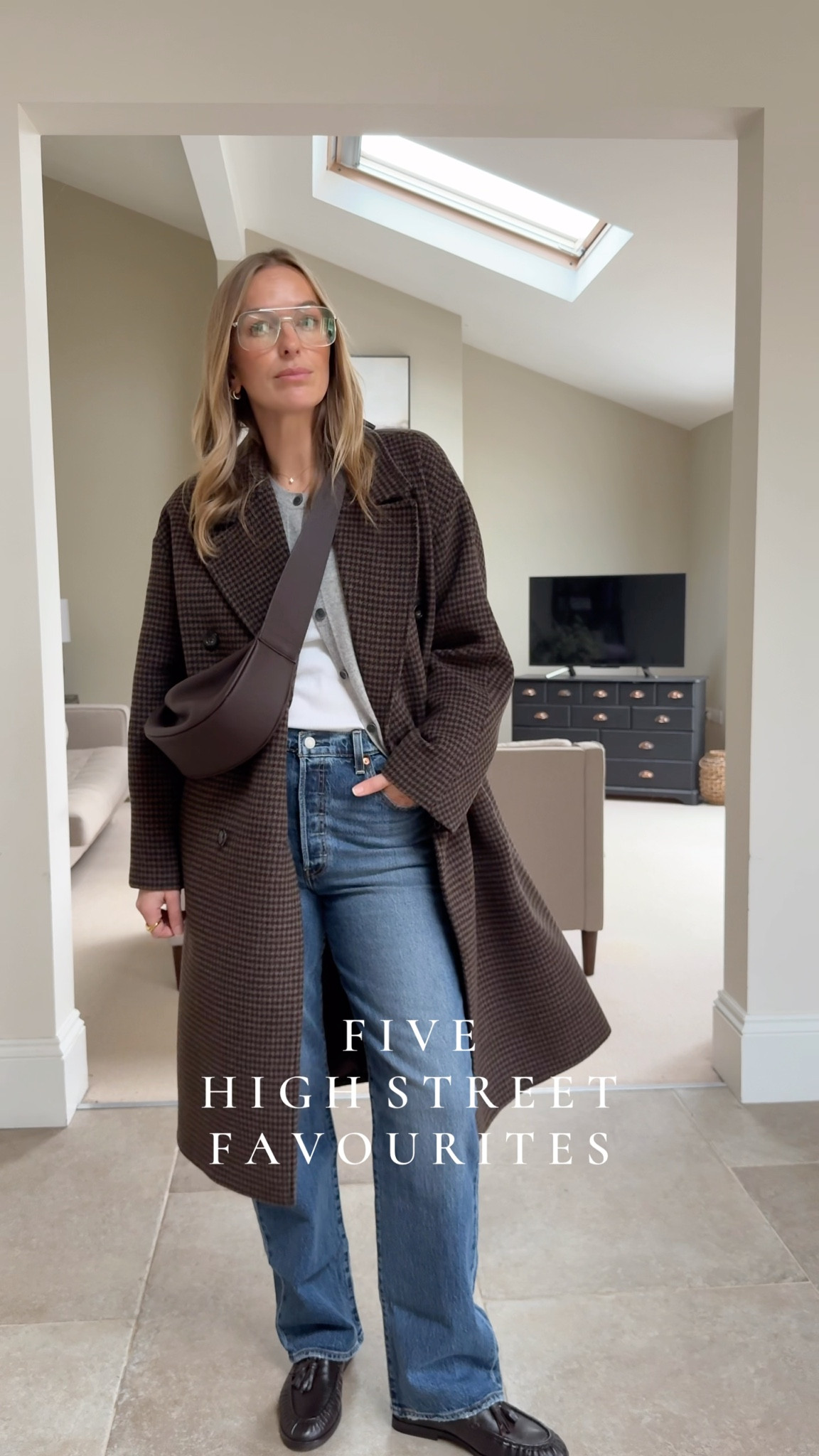 Five high street favourites …. 
- I love this soft , built in bra thermal - such a good layering item - especially when you need a scoop neckline. 
I wear a large. 
- Cashmere cardigan - simple styling tool in 100% cashmere - I prefer these in the marled colours for texture. 
Wearing a large - regular fit - size up for a more relaxed fit.  
-Levi’s Ribcage jeans 
High rise , button fly , structured denim , straight leg. Wear ankle length or full length as I  here. 
Wearing the 31  waist ( this is about a 13 in Levi’s )  32 leg . 
Houndstooth check coat - a lively oversized fit   Great for layering and adding texture and a relaxed tailoring feel. 
Wearing a large 
Bag - a contemporary shape in a full grain leather 
Loafers true to size - half sizes available. 


#LTKjeans #LTKuk #LTKwinter