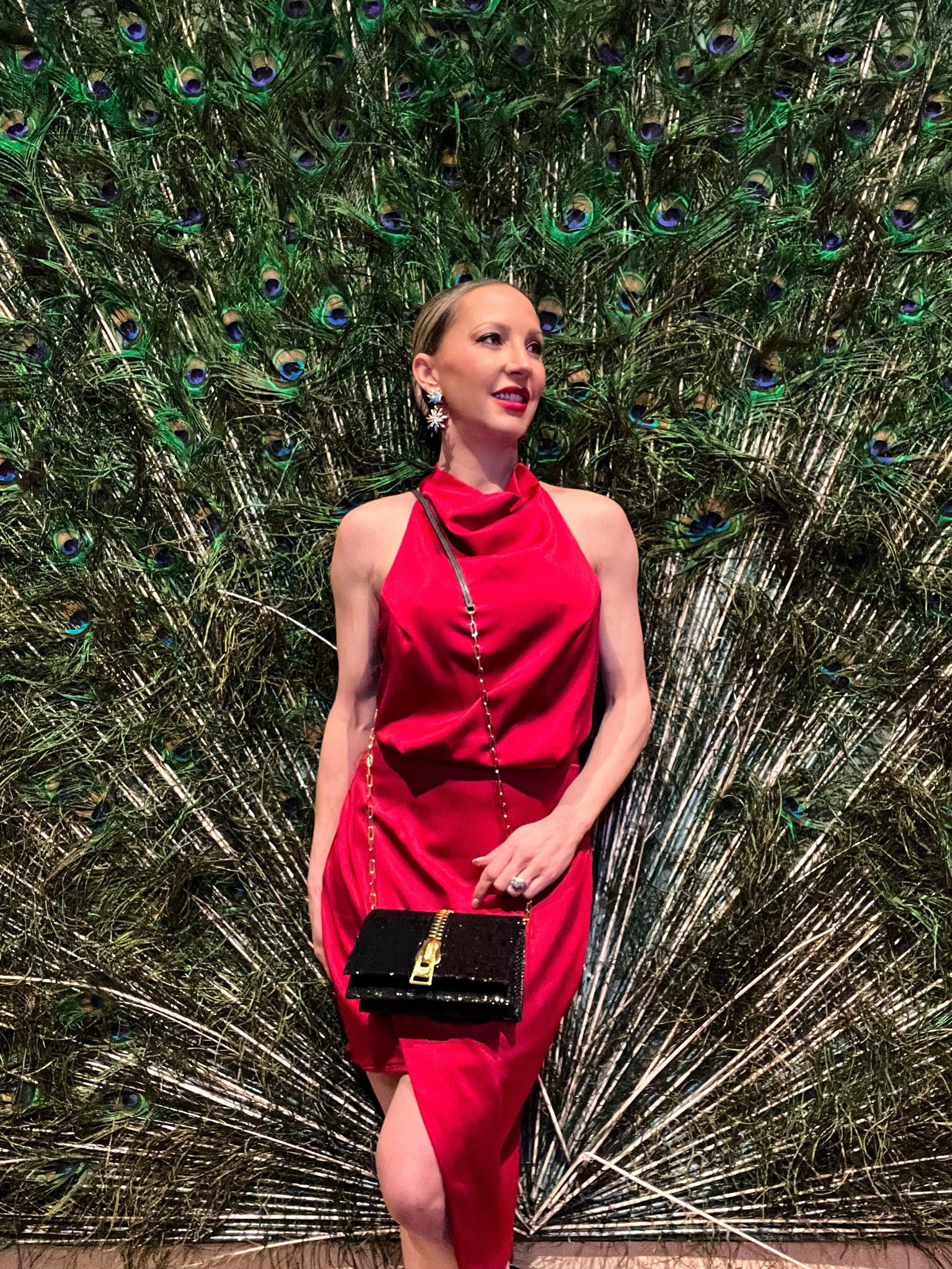 Red satin halterneck mini dress is perfect for holiday parties, Christmas parties and New Year’s Eve parties. It’s super sexy and backless. Black sequin bag with gold hardware is Tom Ford 

#LTKHoliday #LTKstyletip #LTKSeasonal