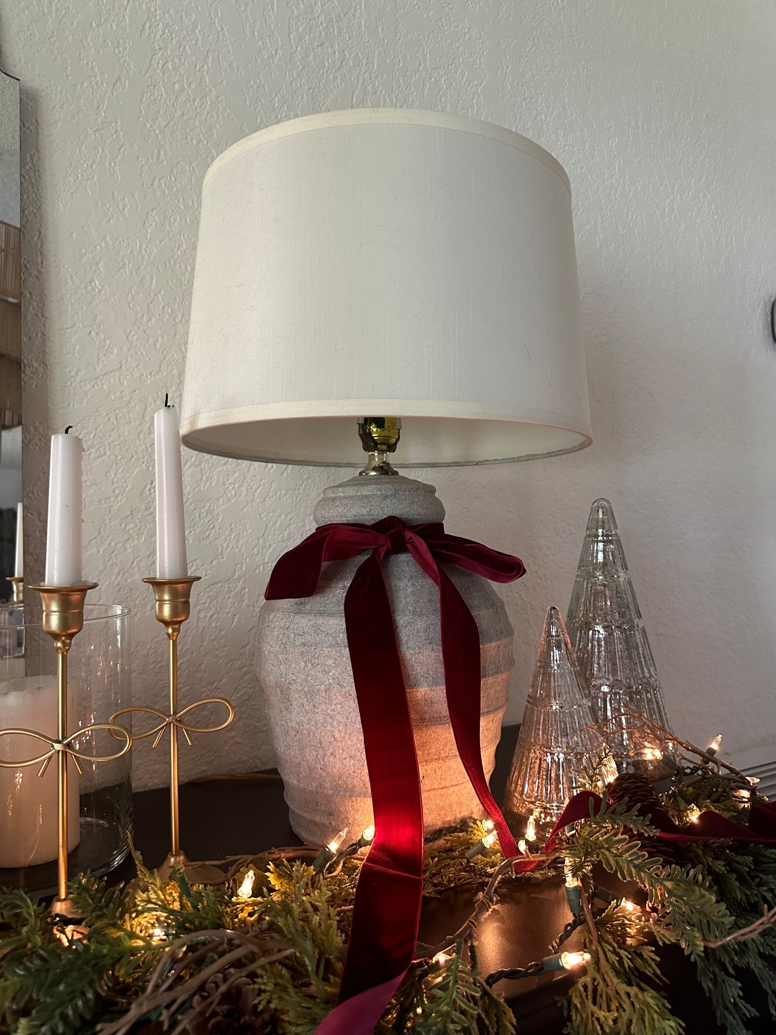 Vintage Christmas decor. I added this beautiful velvet ribbon to my thrifted lamp. The garland and lights make it extra cozy! Bow candle holders. Ceramic Christmas trees 

Mercury glass 
Antiqued glass
Vintage Christmas 
Christmas credenza 
Dining room 
Lamp
Candle holders 
Ralph Lauren Christmas 
Velvet bow 
Pottery barn 
Walmart 
Cozy home 
Home decor 


#LTKHoliday #LTKHome #LTKFindsUnder50