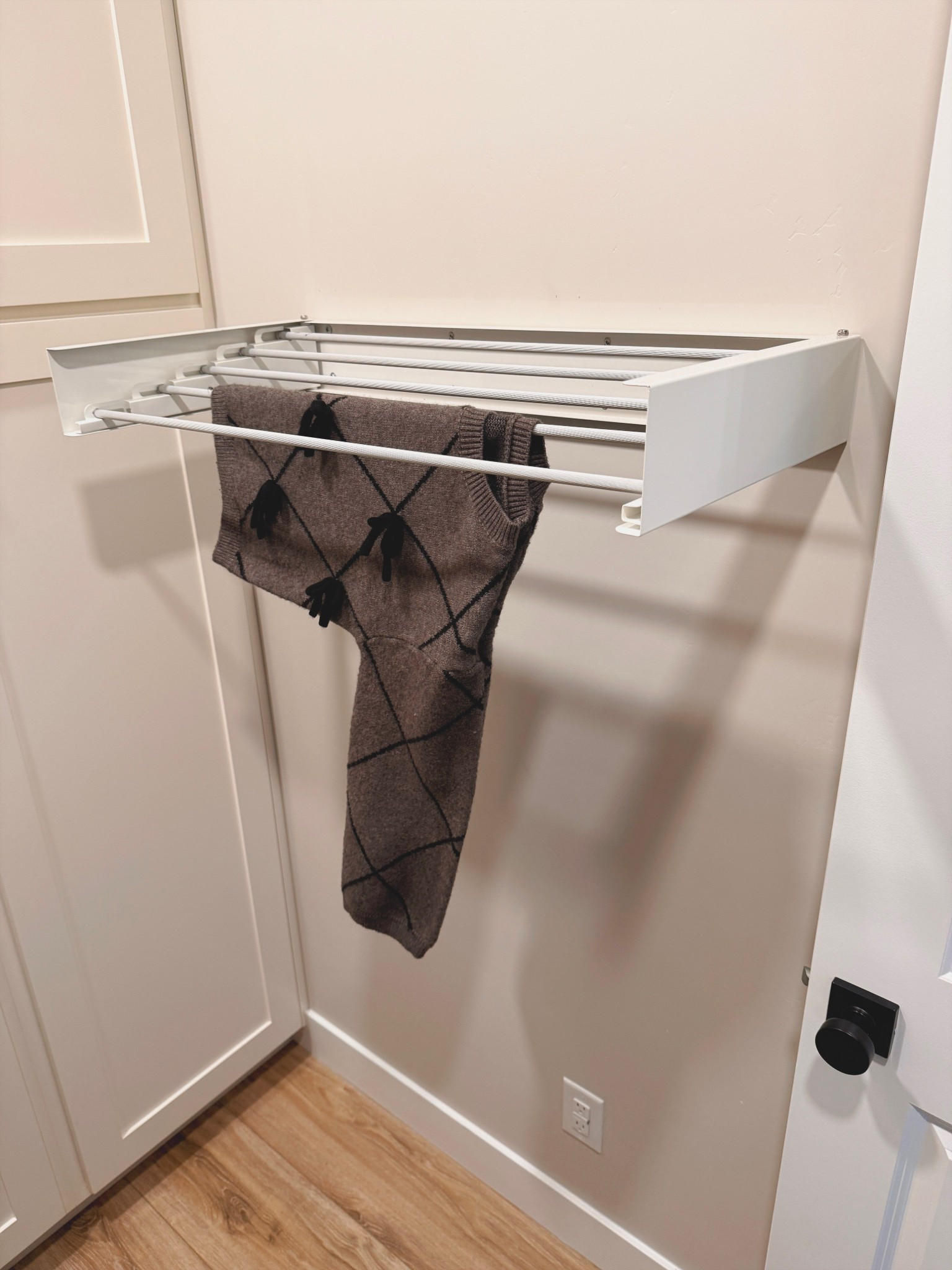 Laundry room, but make it cute. This little fold-down wall rack has been such a game changer for air drying sweaters and delicates without dragging out a bulky drying rack. It tucks away when you’re done and keeps everything off the counters.

laundry room organization, wall mounted drying rack, small laundry room ideas, space saving laundry, fold down drying rack, home organization, functional home finds

#LTKSeasonal #LTKHome #LTKgrwm