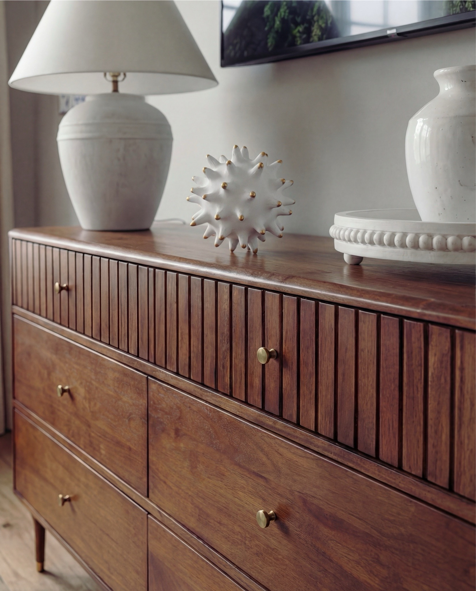 Shop the Look: Bedroom Refresh
• Upholstered bed frame (soft ivory fabric)
• Neutral bedding set (white and light beige)
• Brown throw blanket (plush or wool)
• Blue and ivory accent pillow
• Wood nightstands with drawers (warm oak tone)
• Ceramic table lamps (white base, white shade)
• Blue glass decorative vases
• Framed blue-and-white botanical wall art (set of three)
• Upholstered bench with fluted wood base
• Traditional patterned blue area rug 
• Floor-length neutral curtains
• Wood ceiling beams (natural stained finish)
• Brass decor bowl all catch
• White and blue decor beads 
Blue knitted throw blanket
•wood dresser
•white pedestal bowl
•white terracotta lamp
•round white table decor
•white terracotta vase
•white upholstered wood accent chair
•white terracotta pedestal bowl

#LTKSaleAlert #LTKHome