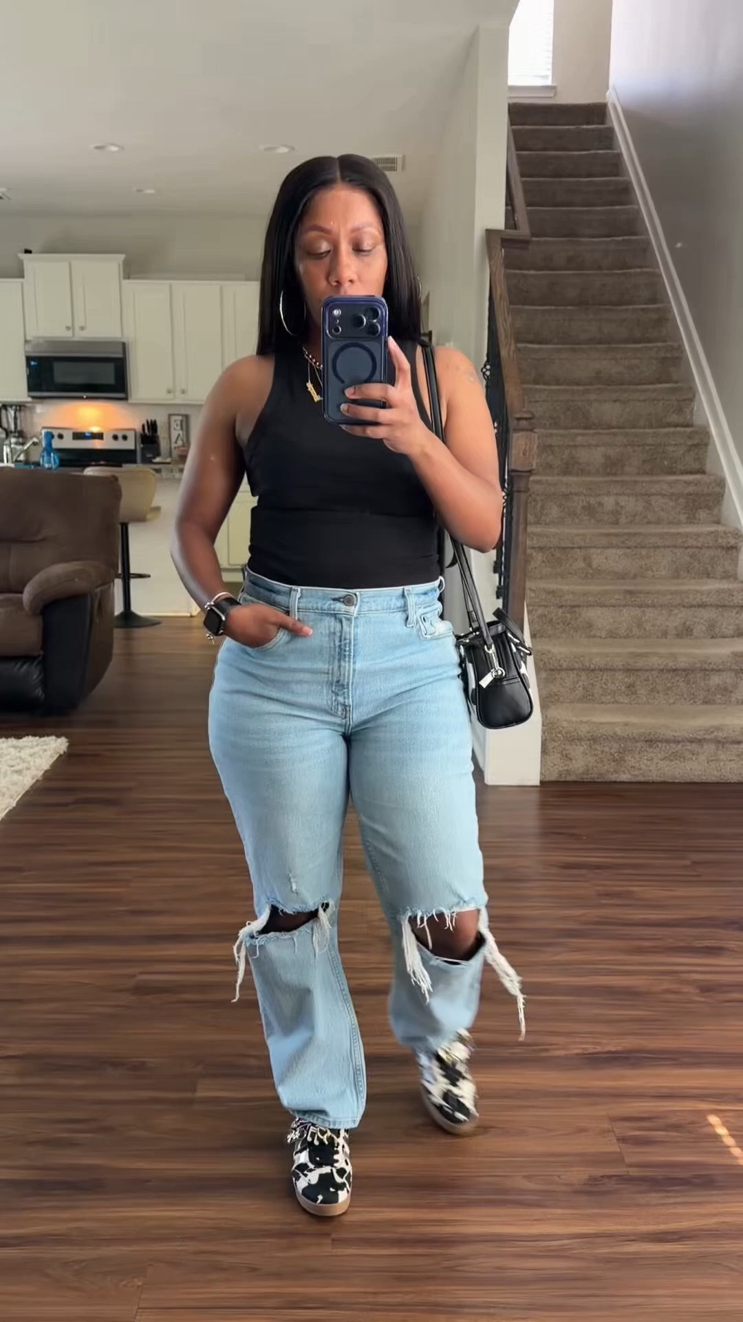 One thing about me, I’m gonna track where my money goes and I’m gonna look cute doing so.

I’m wearing a black racerback tank, high rise distressed jeans, black and white cow print crossbody purse, and black and white cow print sneakers.

#LTKdayinmylife #LTKOver40 #LTKootd