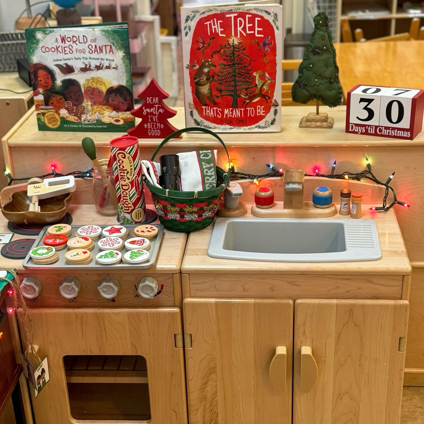 🎄Our Christmas dramatic play area is ready for the season! Though dramatic play isn’t traditionally Montessori, it IS required by the state, so we’ve added a Montessori twist to make it extra meaningful:

🍪 Children can slice and serve wooden Christmas cookies, practicing coordination and hospitality.
🎁 They’re also rolling holiday napkins, building fine motor skills and practical life skills.
📚 Our featured book introduces Christmas cookie traditions from around the world, sparking curiosity and cultural appreciation.

Our dramatic play area is all about blending festive fun with practical life skills and global learning! What’s your favorite holiday tradition to explore with kids?

#montessoripreschool #handsonlearning #learnthroughplay #montessorimom #montessoriathome #preschoolteacher

#LTKSeasonal #LTKHoliday #LTKKids