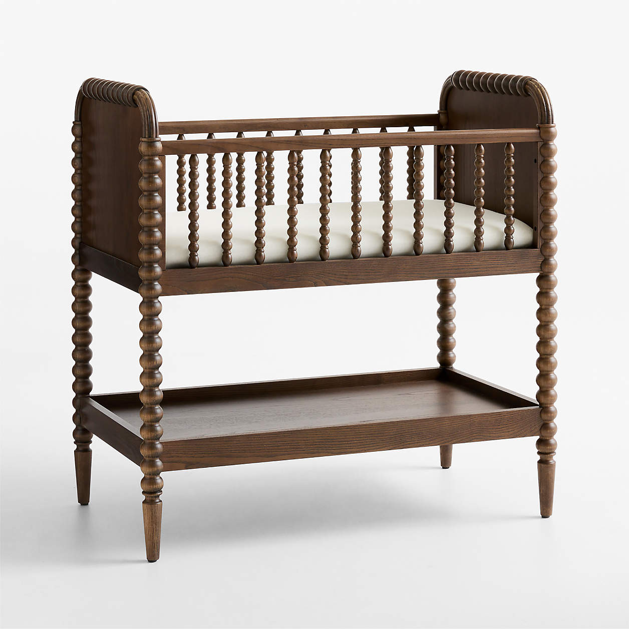 Jenny Lind Heirloom Deep Brown Wood Baby Bassinet with Mattress Pad | Crate & Kids | Crate & Barrel