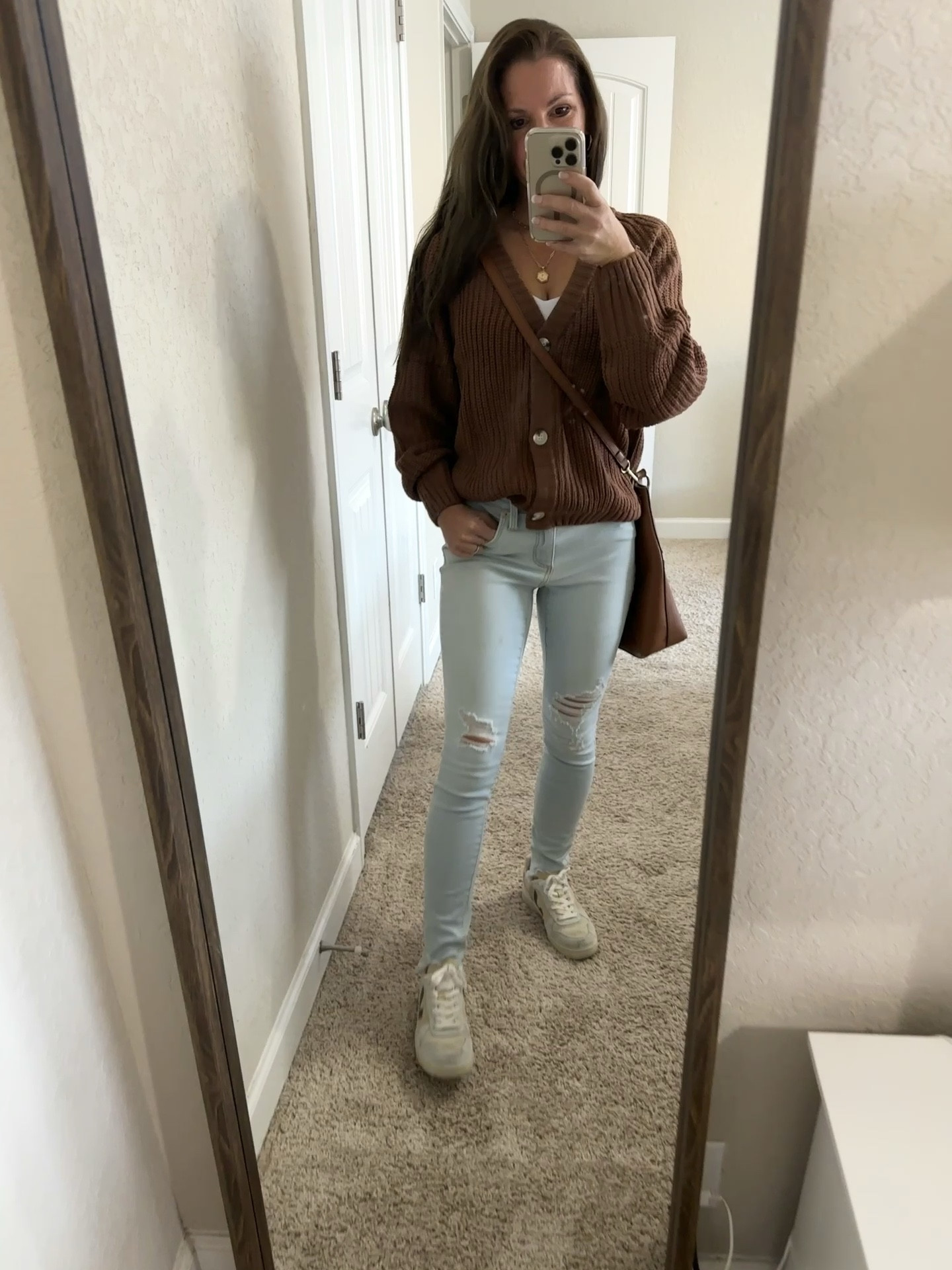 Fall casual outfit. 🍁

Wearing size small sweater and white cropped tank top, 0/25 jeans. 

#LTKU #LTKSeasonal #LTKfindsunder50