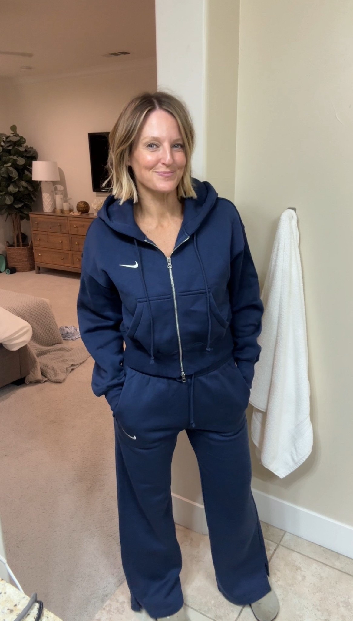 This Nike sweatsuit has my 🫶🏻

Along with all the other products from my morning routine. 

Nike - small in pants and hoodie (navy hoodie is sold out, but linked other options)
Pjs - medium 

Leggings - xs 
Crop tank - s
