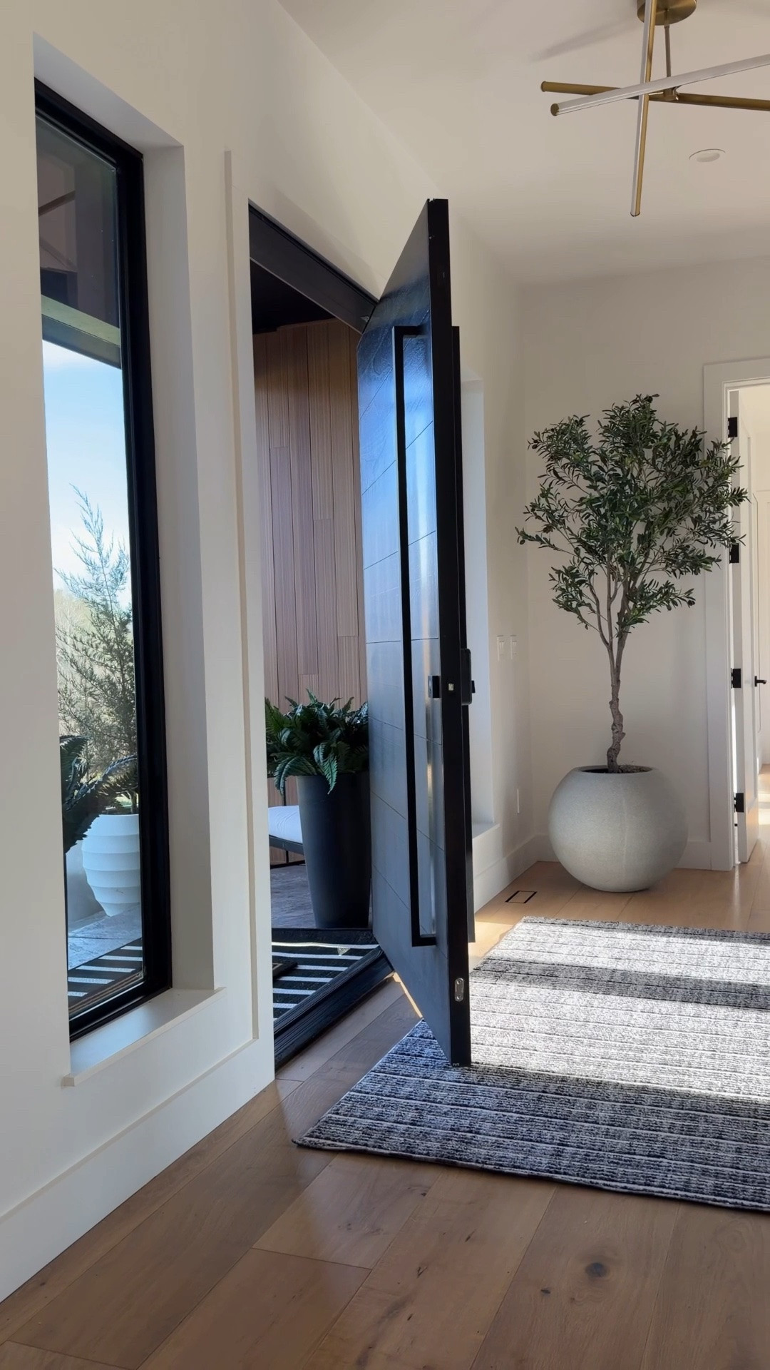 Entryway styling 🤍
 
rug, planter, tree, wall art, bench, neutral, modern, home decor

#LTKHome