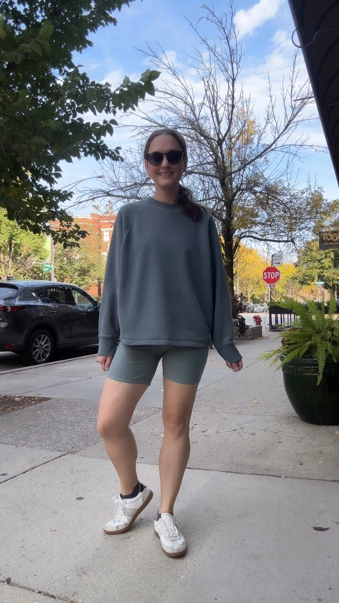 For this unseasonably warm, 78-degree Tuesday in late October, she ditched the layers and pulled on her trusty biker shorts and a coordinating tank, tossed on an oversized sweatshirt for good measure, and laced up her go-to new sneakers. The finishing touches—her everyday gold hoops—added just the right amount of sparkle for a morning at their final toddler fitness class of the season. She couldn’t help but smile at the irony of her little pumpkin bouncing around while she sported an outfit that felt more summer than Halloween week.

#LTKFamily #LTKStyleTip #LTKSeasonal