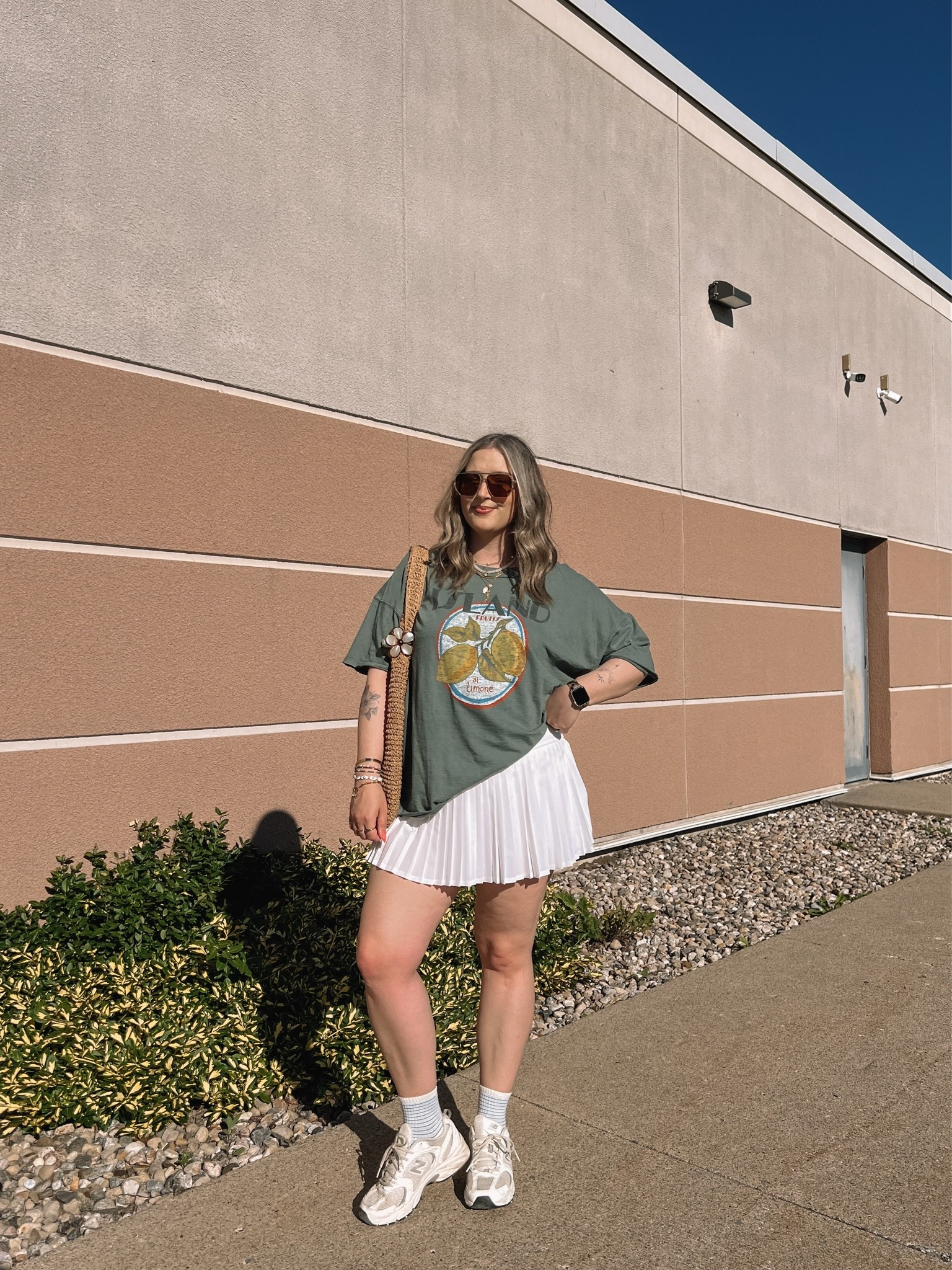 Casual spring to summer outfit! Wearing my usual size L in the graphic tee. Wearing M in the white tennis skirt, I bought it years ago & if I was ordering now I’d get L although M still fits. New Balance sneakers run a little big, I’m a 9.5-10 and wear a 9

#LTKsummer #LTKsale #LTKstyletip