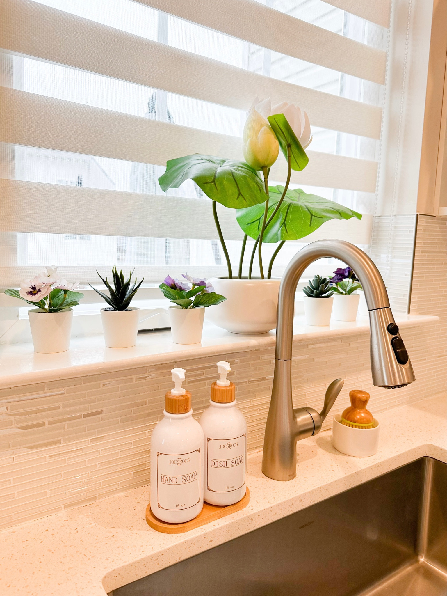 Kitchen sink decor 

Soap dispensers & brush - Amazon 
Flower pots - Ikea
Zebra roller blinds - Amazon  #LTKxPrimeDay

#LTKhome #LTKstyletip
