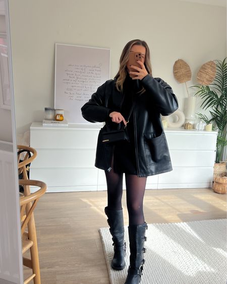 All black outfit styling oversized nasty gal leather jacket with black mini skirt and roll neck from marks and Spencer, black knee high biker boots and Jacquemus le chiquito noeud. Perfect autumn outfit 

#LTKshoecrush #LTKeurope #LTKfindsunder100