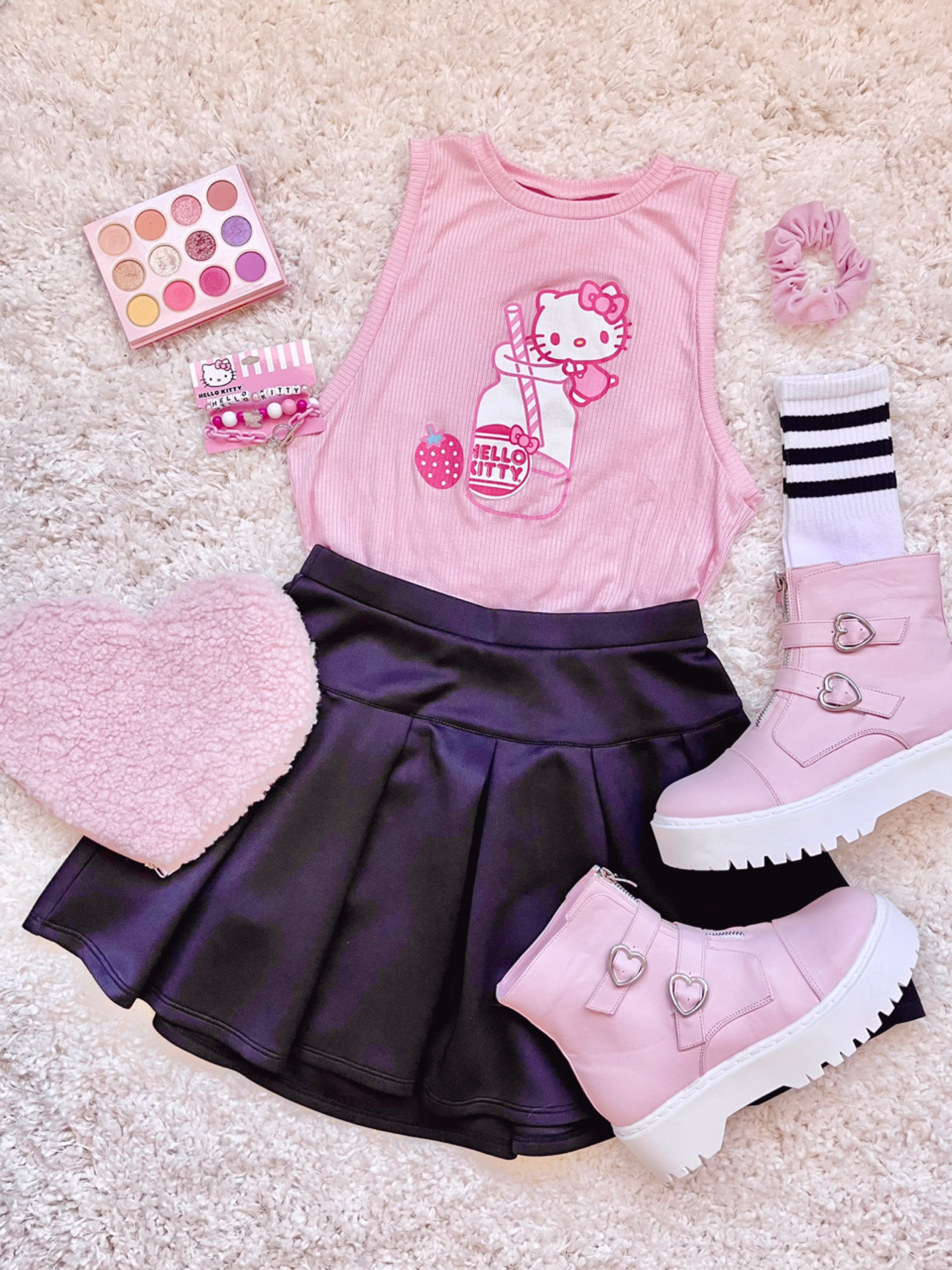 STRAWBERRY MILK~ 🍓🥛💕 I had so much fun putting together this super cute Hello Kitty-themed fashion flatlay! 😻 Here’s what I used for this outfit:

- Sleeveless Hello Kitty Strawberry Milk top
- Black skater skirt
- Pink combat-style booties with silver heart hardware
- ColourPop x Sailor Moon eyeshadow palette 🌙⭐
- Matching pink accessories

I’ve linked everything below! Some items may not be available at the moment, so I included some alternatives/similar pieces too! 😍

💗🌸💗🌸💗🌸💗

Hello Kitty and Friends, Hello Kitty outfit, Sanrio, kawaii fashion, alt fashion, alternative fashion, friendship bracelets, pink outfit, casual outfit, Colour Pop, Sailor Moon eyeshadow palette, plush bag, black pleated skirt, black skater skirt, crew socks, flat lay, combat boots

#LTKShoeCrush #LTKItBag #LTKPetite
