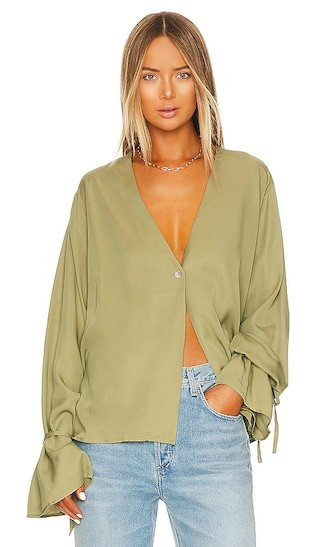 L'Academie Tie Sleeve Blouse in Olive. - size M | Revolve Clothing (Global)
