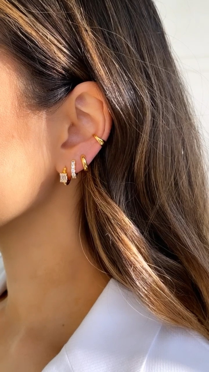 My favorite earring stack from my jewelry and accessories line 🤍

Bottom to top: 
• Camille earrings
• Carrie Huggies [also available in rhodolite, a pink/magenta cz] 
• Bailey Huggies
• Jodie ear cuff - no piercing needed! 

Under $50 / earrings / jewelry / hoops / dainty

#LTKstyletip #LTKfindsunder50