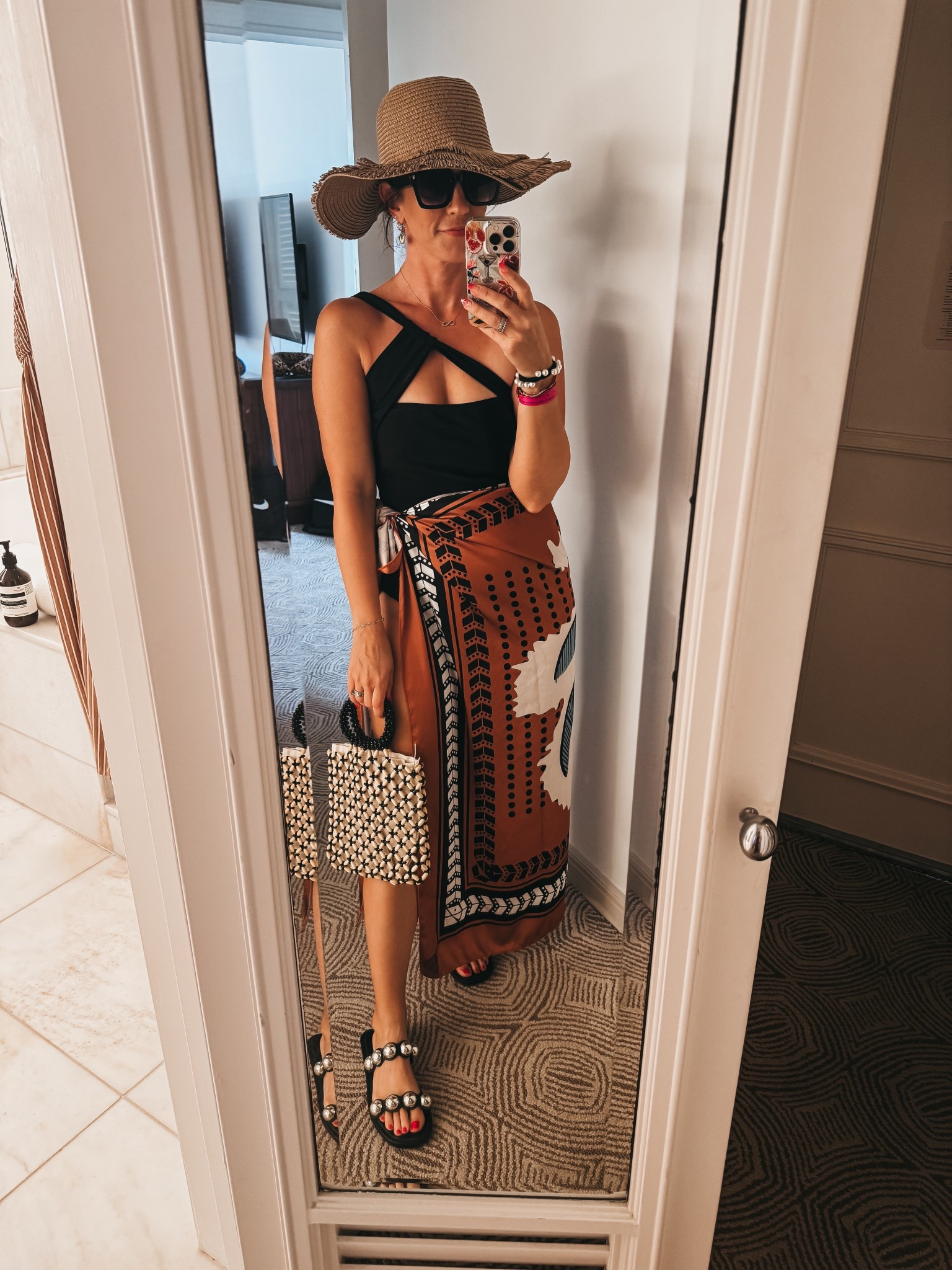 Wear this cute sarong maxi cover up (size medium) with a plain black suit (medium) 

*The hat is so fun and looks like a tiki hut 🛖 

*** I don’t love the fit of the suit it comes with! So I’ll wear it like this! 🤎

#LTKOver40 #LTKFindsUnder50 #LTKSwim