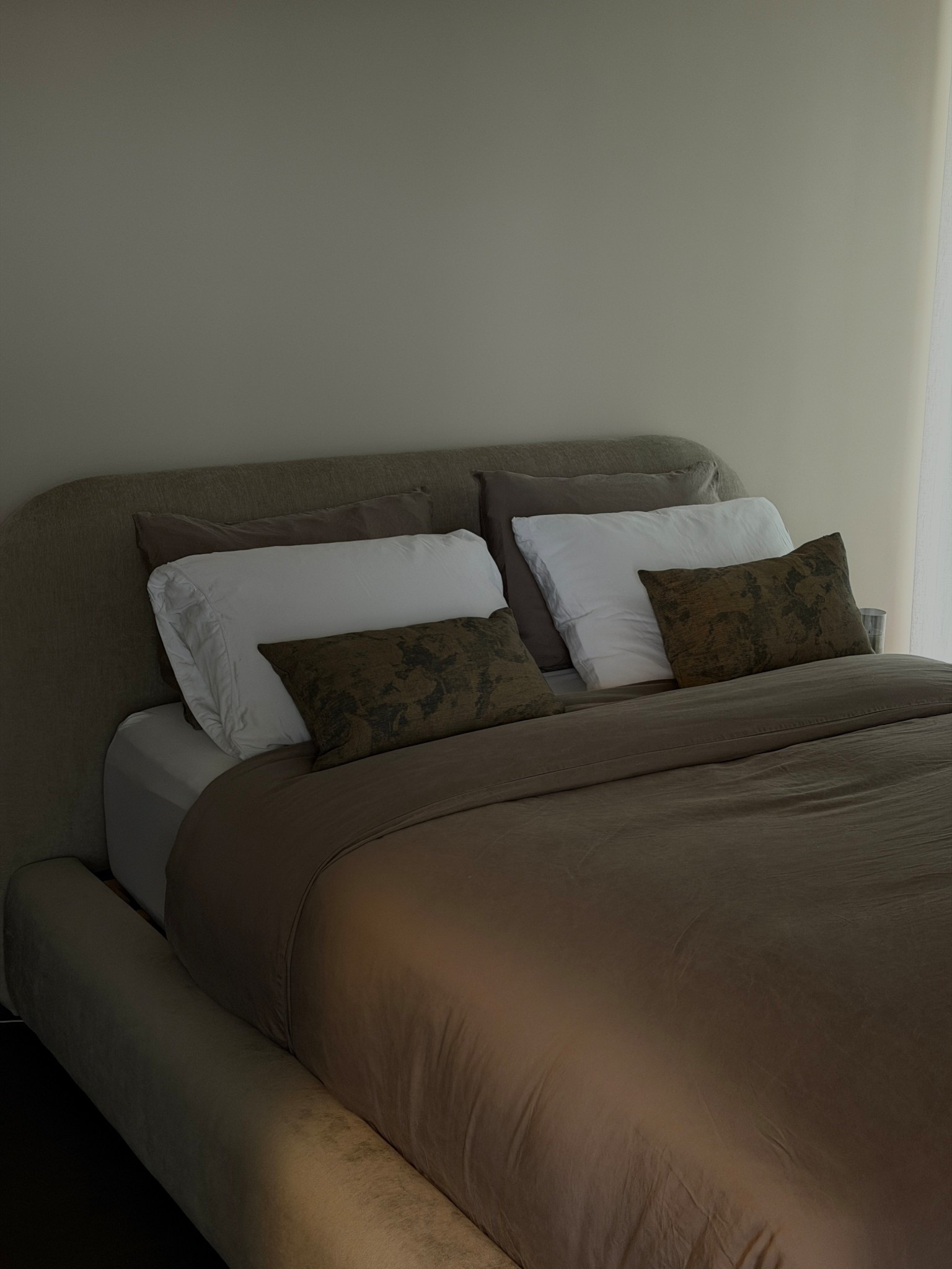 new bedding that makes the space feel cozier 🤎