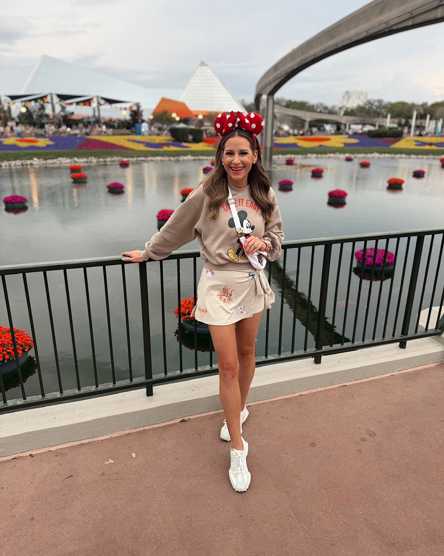 Today’s Disney park ootd! In a small Etsy romper dress, small sweatshirt, sneakers, Etsy ears and accessories - fits tts. What to wear at Walt Disney world spring women 

#LTKootd #LTKSeasonal #LTKTravel