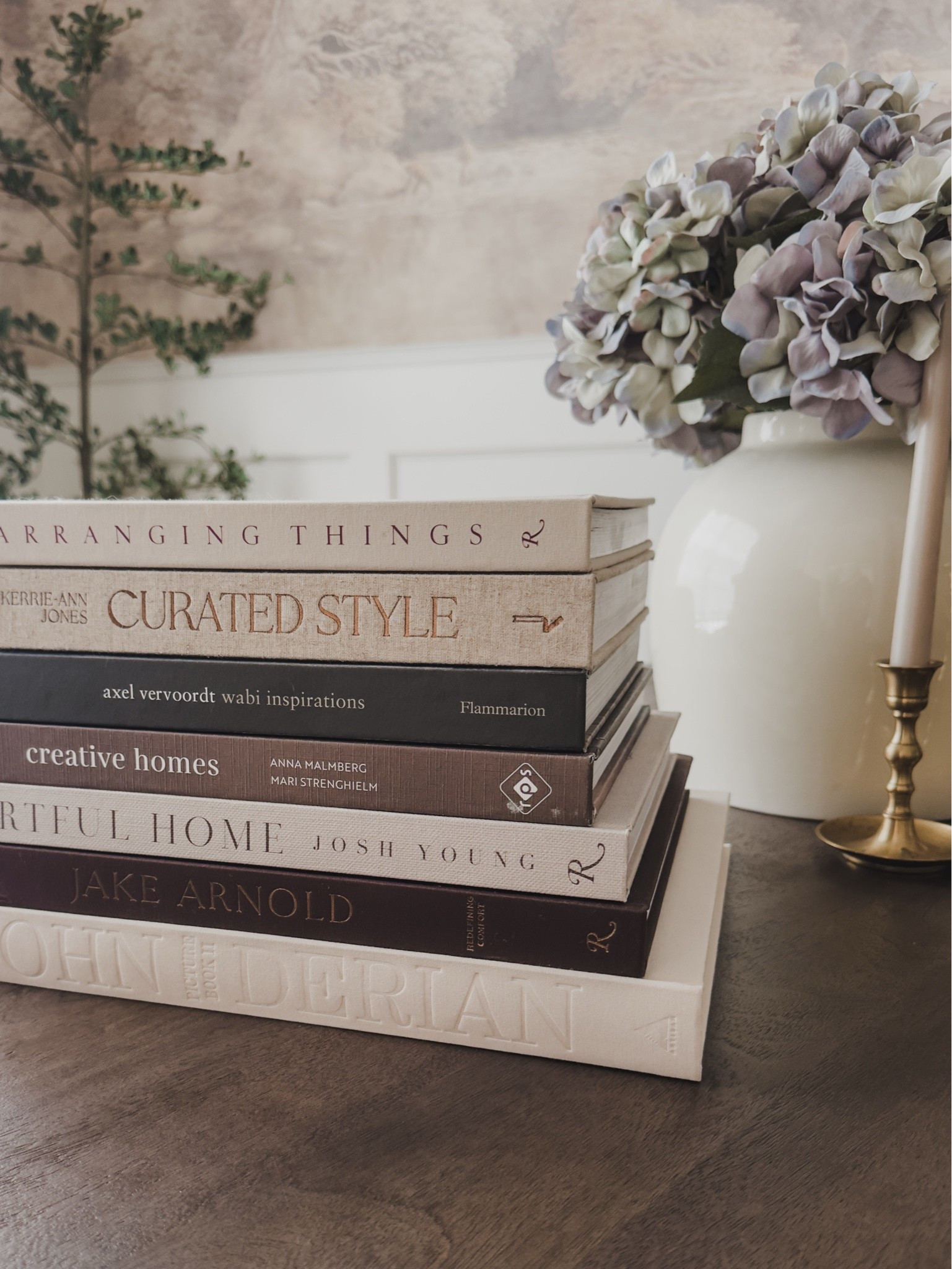 I always love a good neutral decor book and these are some of my favorite! All of these books are easy to mix and match or add to any space! Combined with natural elements like faux florals or trees, as well as brass elements.

Home finds, neutral home inspo, decor details, collected style, neutral decor book, faux florals, faux olive tree, brass details, tapered candle, rich wood tones, round dining table, mural art, classic home style, found it on Amazon, Wayfair, Pottery Barn style, Etsy, Afloral, shop the look!

#LTKSeasonal #LTKHome