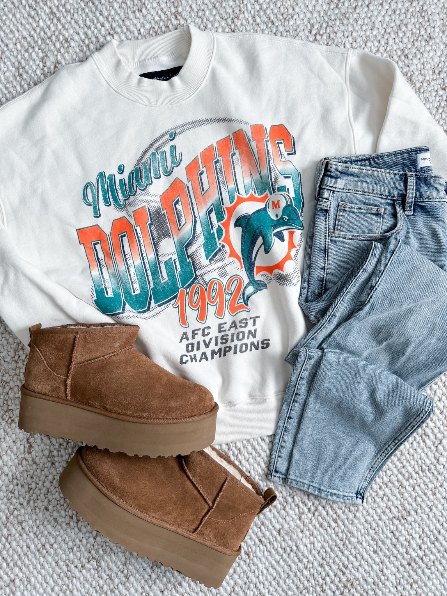 When your husband is a Miami Dolphins fan. Cozy Saturday outfit idea. 

UGG Platform - Abercrombie Sweatshirt - Abercrombie Denim - Oversized Sweatshirt - Outfit Idea 

#uggs 

#LTKstyletip