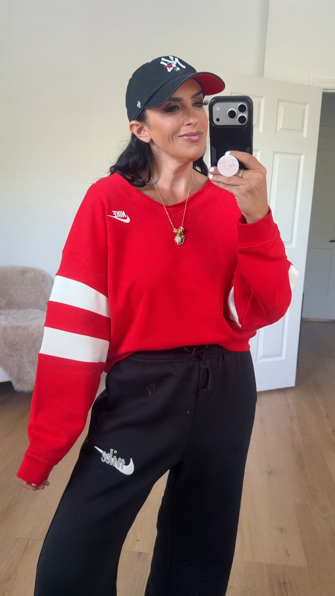 Nike sportswear club fleece women’s oversized v neck sweatshirt in university red sail wearing size small 