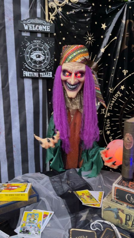 This animatronic fortune teller was a hit at our Halloween Carn-EVIL!  She is 6’ but adjustable so I was able to sit her at a fortune teller table (remove one bar from the stand).  She had multiple fortunes for your Trick or Treaters….spooky! Currently 15% off!

#LTKparties #LTKsalealert #LTKSeasonal