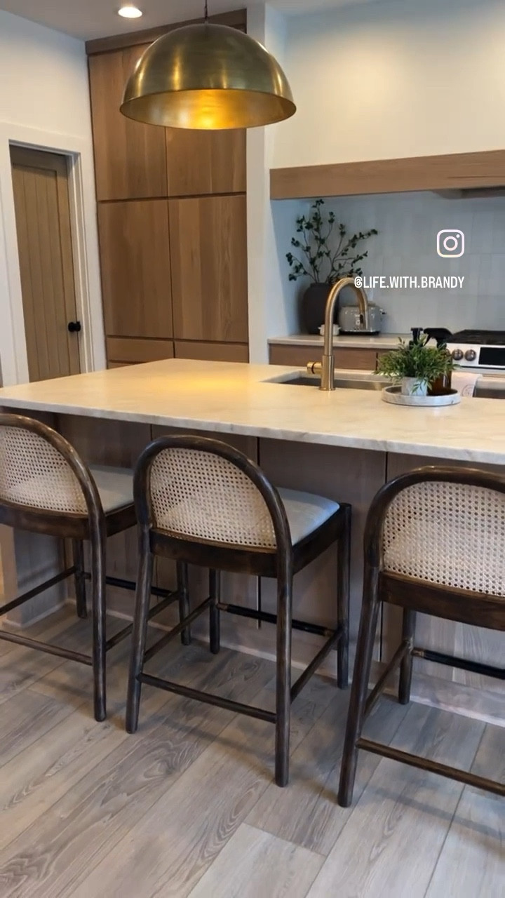 Here’s the scoop on these McGee Hadden “Dupe” barstools ❗️
•
so I’ve had these Amazon barstools for 9 months (since before they became popular in the “influencer” world) and here’s what I have to say.
•
1️⃣⬇️
The quality is absolutely there (or at least these ones are), and for the price I feel like they are a steal BUT here’s the issue
2️⃣⬇️
The seat material was absolutely awful. Back in February I reupholstered mine (so easy!) with some wipeable linen look-alike material. I don’t know why anyone ever thought it would be a good idea to have a stool in an area that you eat — that isn’t wipeable and in fact basically soaks up stains? 🤔
(see my barstool redo highlight for more info on the material!)
ANYWAYS they are soooo easy to clean now! Much better 👏🏻
3️⃣⬇️
The OG stain was lovely, but it was too close of a match to my cabinets and I was looking to add depth and warmth to our space so I chose to also restain them a darker color 🤎

#LTKHome #LTKFamily #LTKVideo